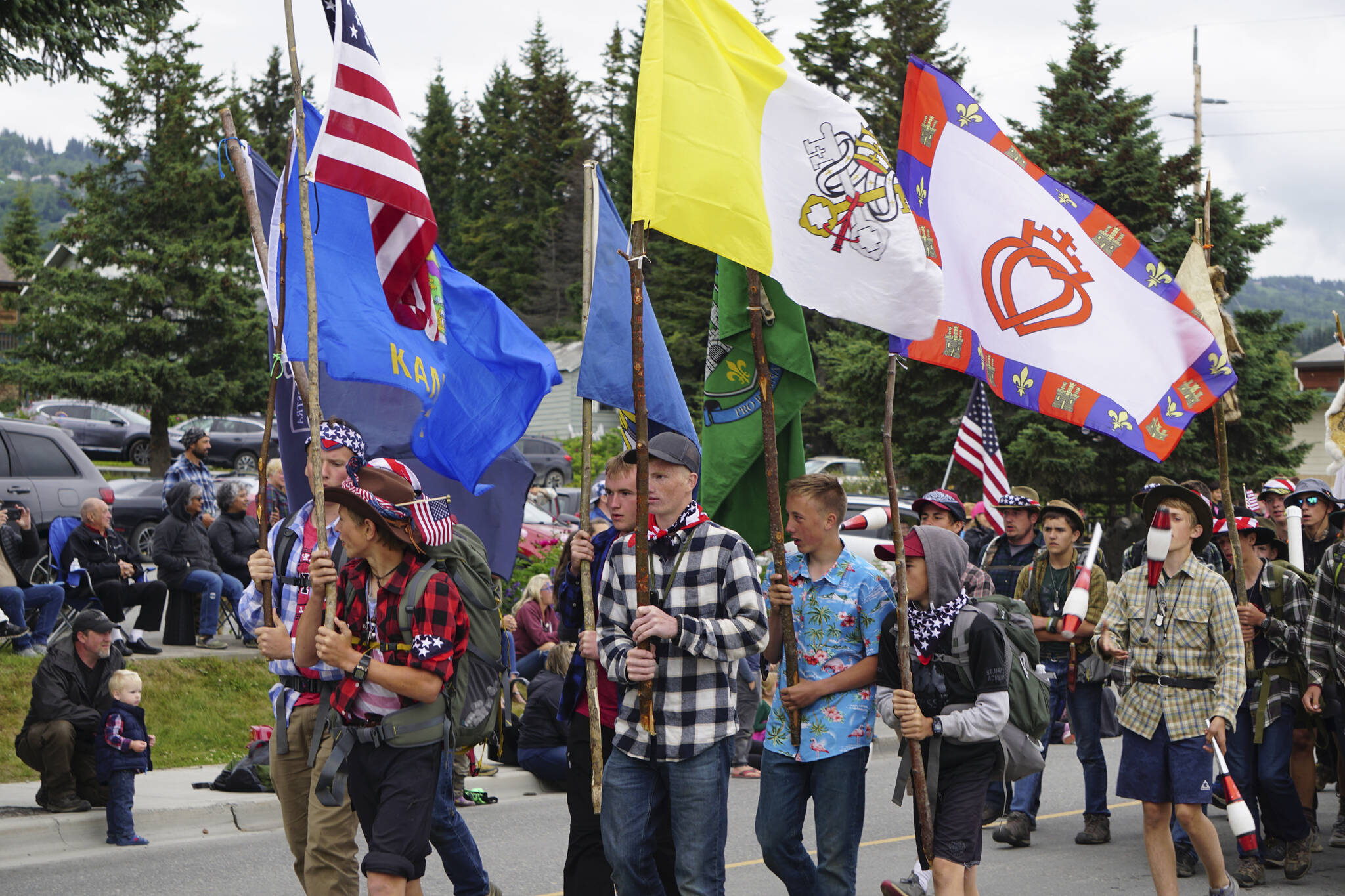 Young men from St. Mary’s Academy, St. Mary’s, Kansas, and members of the Knights of Immaculata, march in the Homer Fourth of July parade on Monday, July 4, 2022, on Pioneer Avenue in Homer, Alaska. The group of about 50 men and boys camped in Homer as part of their trip. The group won Best in Show for the parade. (Photo by Michael Armstrong/Homer News)