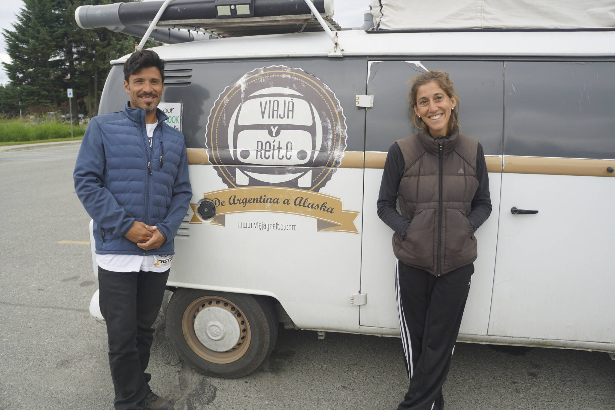 Photo by Michael Armstrong/Homer News Louis Garnero, left, and Maria Bisotto, right, stand next to their 1986 Volkswagen van on Thursday, July 7, 2022, in the parking lot of the Homer Public Library in Homer, Alaska. From Cordoba, Argentina, starting in 2016 they drove their Type 2 VW Kombi all the way from Argentina to Alaska, about 70,000 miles. Garnero and Bisotto arrived in Homer at the End of the Road on Wednesday, July 6. They stayed in Mexico for 18 months during the COVID-19 pandemic. They have written about their adventures in a book in Spanish, “LiberArte: Historia de viaje y algo mas,” with illustrations by Garnero. “Viaja y reite” means “travel and laugh” in Spanish. The couple converted the van to a camper themselves. Although VW quit exporting the T2 to United States in 1979, it continued to make the T2 microbus in Brazil until 2013. For more on their adventures, visit https://viajayreite.com/liberarte-historias-de-viaje-y-algo-mas. https://viajayreite.com/liberarte-historias-de-viaje-y-algo-mas/