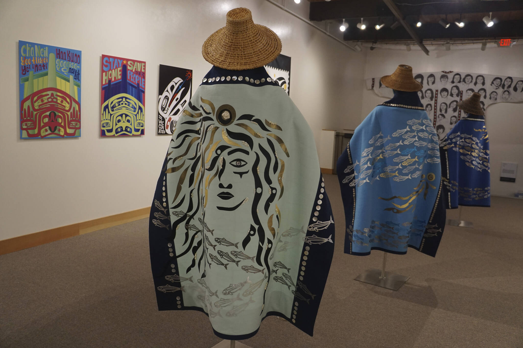 “Protection: Adaptation and Resistance” includes these robes, “Kaxhatjaa X’óow: Herring Protectors,” made by Káakaxaawulga/Jennifer Younger, K’asheechtlaa/Louise Brady and Carol Hughey. The show is on exhibit at the Pratt Museum & Park in Homer, Alaska, through Sept. 24, 2022. (Photo by Michael Armstrong/Homer News)