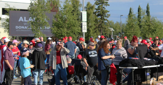 People gather outside of the Alaska Airlines Center, where a Save America rally was being held, on Saturday, July 9, 2022 in Anchorage, Alaska. Former President Donald Trump, U.S. Senate candidate Kelly Tshibaka and U.S. House candidate Sarah Palin were among the event’s speakers. (Ashlyn O’Hara/Peninsula Clarion)