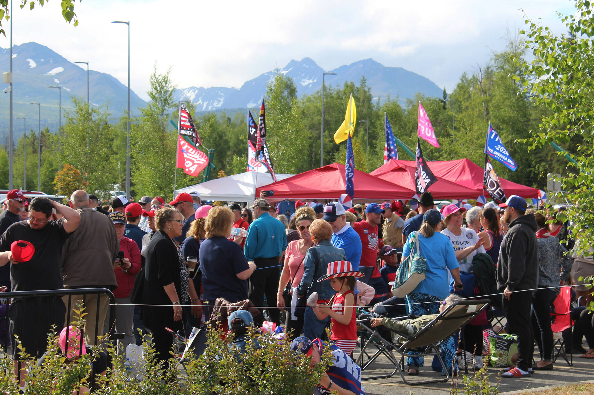 People gather outside of the Alaska Airlines Center, where a Save America rally was being held, on Saturday, July 9, 2022 in Anchorage, Alaska. Former President Donald Trump, U.S. Senate candidate Kelly Tshibaka and U.S. House candidate Sarah Palin were among the events speakers. (Ashlyn OHara/Peninsula Clarion)
