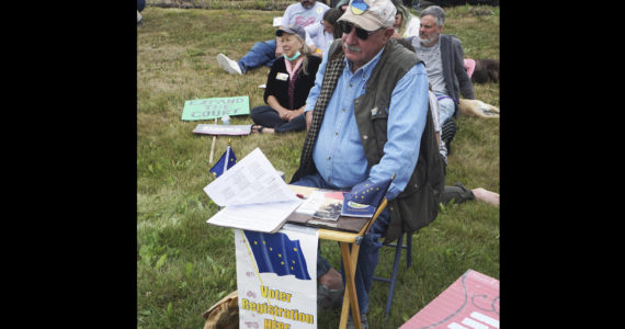 Ken Landfield staffs a voter registration table on Saturday, July 9, 2022, during the "Bans off our bodies" march and protest at WKFL Park in Homer, Alaska. (Photo by Michael Armstrong/Homer News)