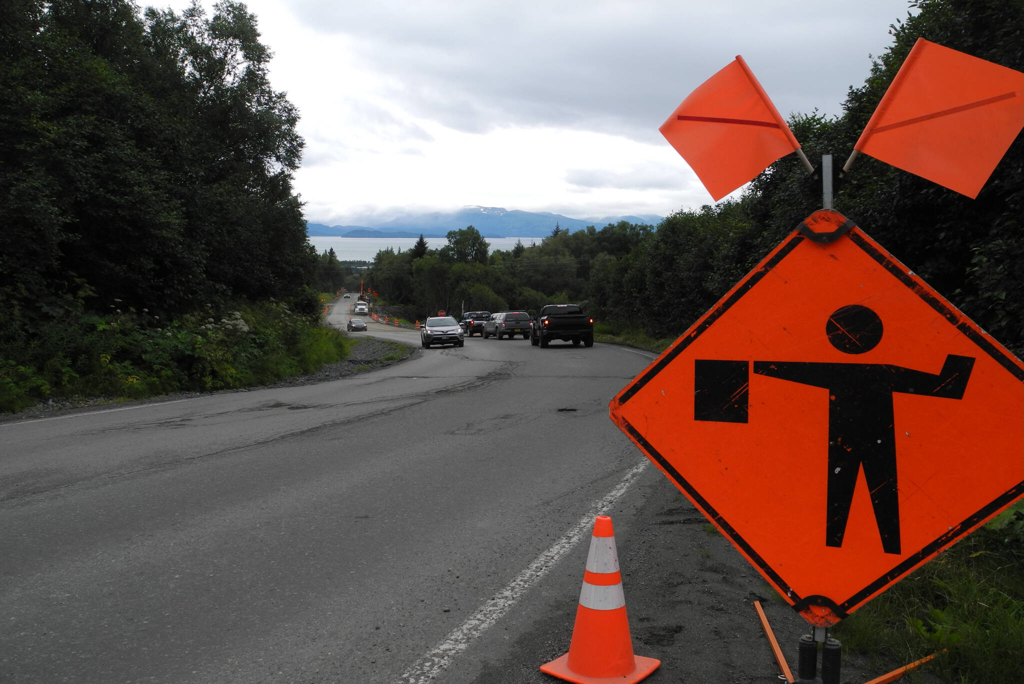 Sign indicating flaggers are ahead on East Hill Road on Monday, July 25, 2022, in Homer, Alaska. (Photo by Charlie Menke/Homer News)