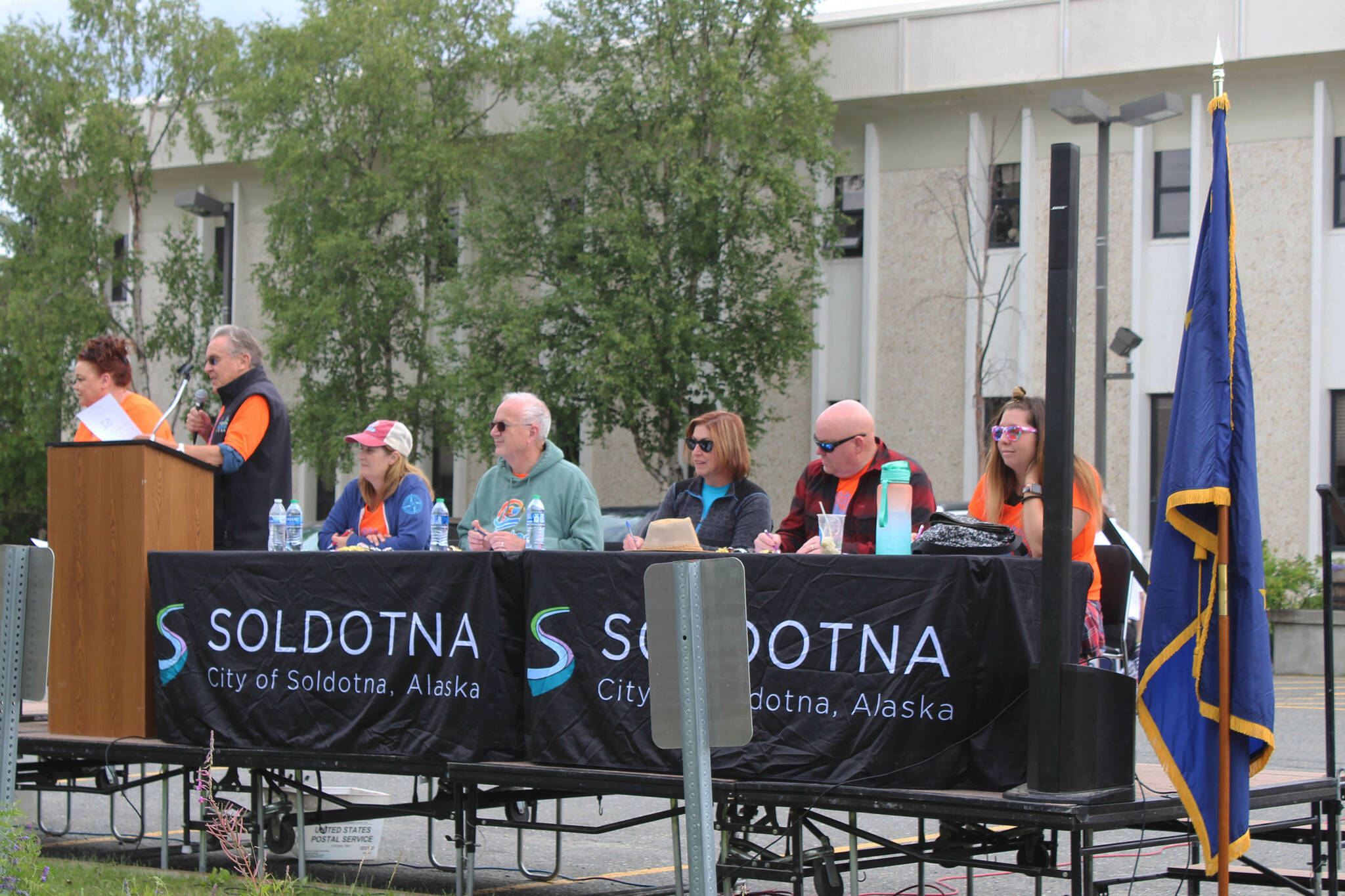 Panelists judge floats in the 65th annual Soldotna Progress Days Parade on Saturday, July 23, 2022, in Soldotna, Alaska. (Ashlyn O’Hara/Peninsula Clarion)