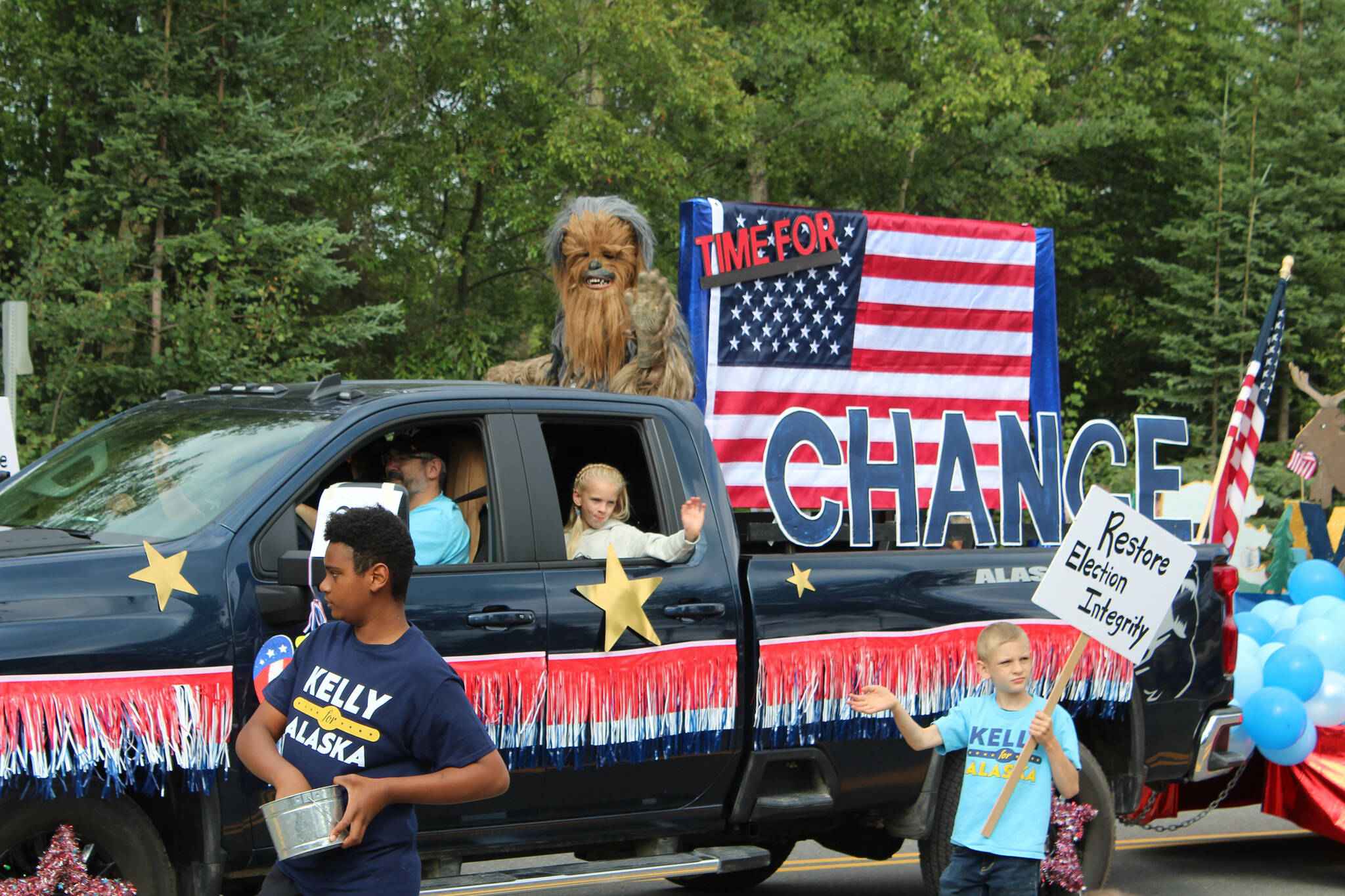 Supporters of 2022 U.S. Senate candidate Kelly Tshibaka walk in the 65th annual Soldotna Progress Days Parade on Saturday, July 23, 2022, in Soldotna, Alaska. (Ashlyn O’Hara/Peninsula Clarion)