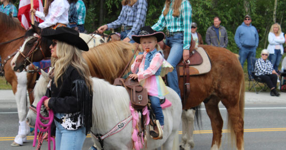Riders with Alaska C&C Horse Adventures participate in the 65th annual Soldotna Progress Days Parade on Saturday, July 23, 2022, in Soldotna, Alaska. (Ashlyn O’Hara/Peninsula Clarion)