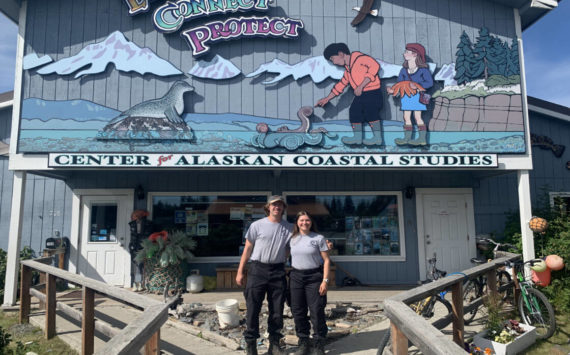 Emily Matthews and Andy Kowalczyk pose outside the Center for Alaskan Coastal Studies headquarters on Friday, July 29, 2022, in Homer, Alaska. (Photo by Charlie Menke/Homer News)
