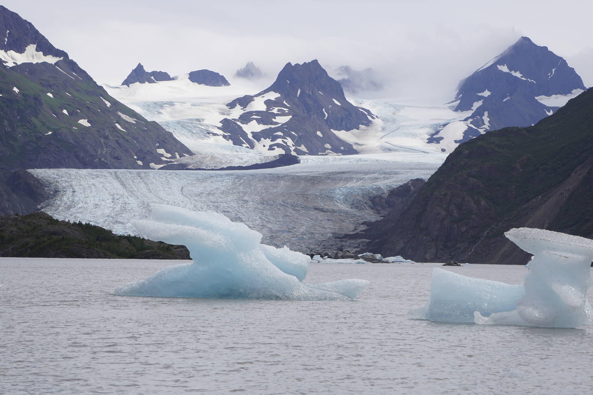 Icebergs have been pushed close to shore at Grewingk Glacier Lake on Monday, July 25, 2022, in Kachemak Bay State Park near Halibut Cove, Alaska. (Photo by Michael Armstrong/Homer News)