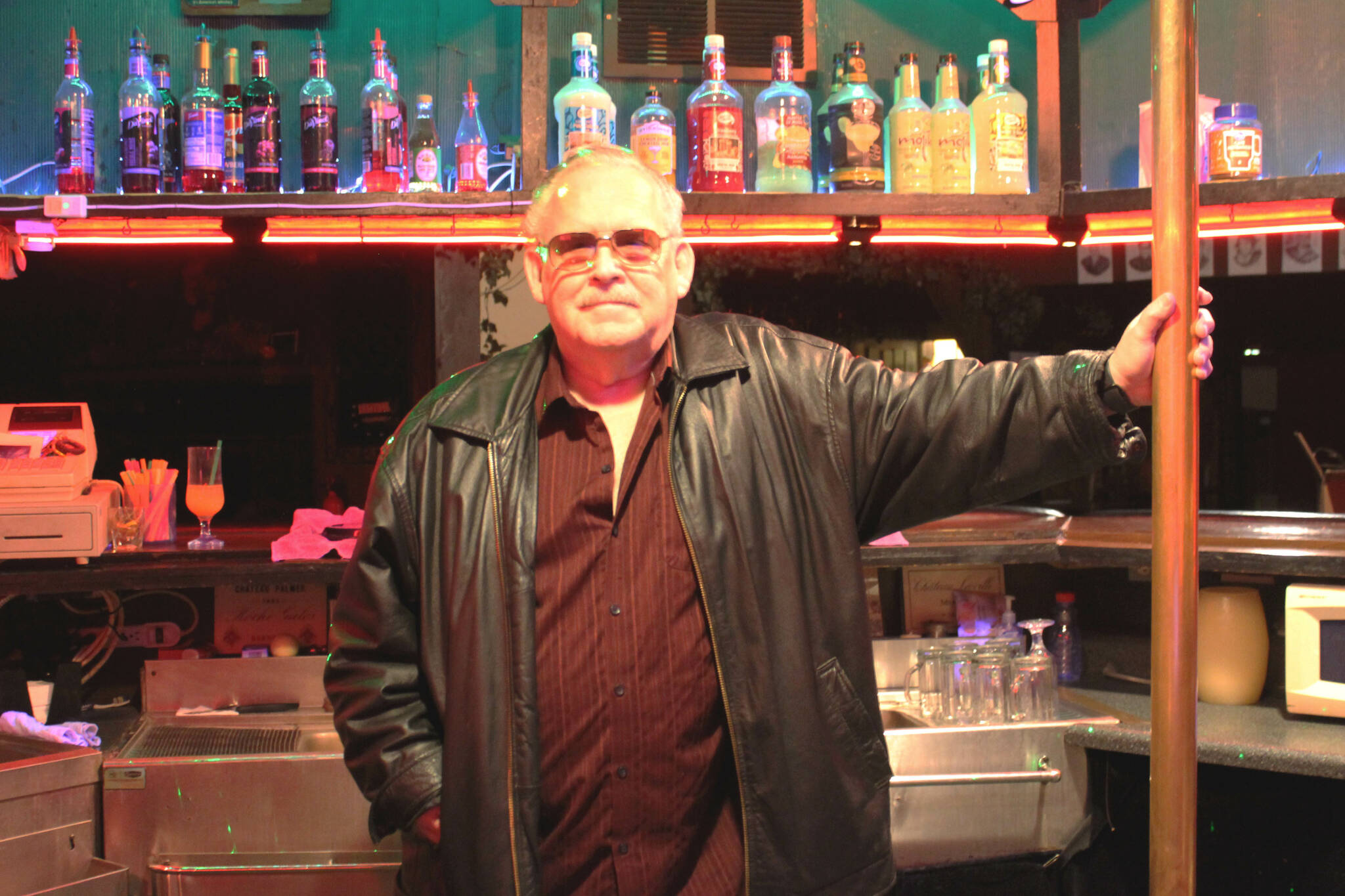 Charlie Cunningham stands behind the bar at Good Time Charlies on Monday, Aug. 1, 2022, in Soldotna, Alaska. (Ashlyn O’Hara/Peninsula Clarion)