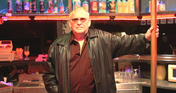 Charlie Cunningham stands behind the bar at Good Time Charlies on Monday, Aug. 1, 2022, in Soldotna, Alaska. (Ashlyn O’Hara/Peninsula Clarion)