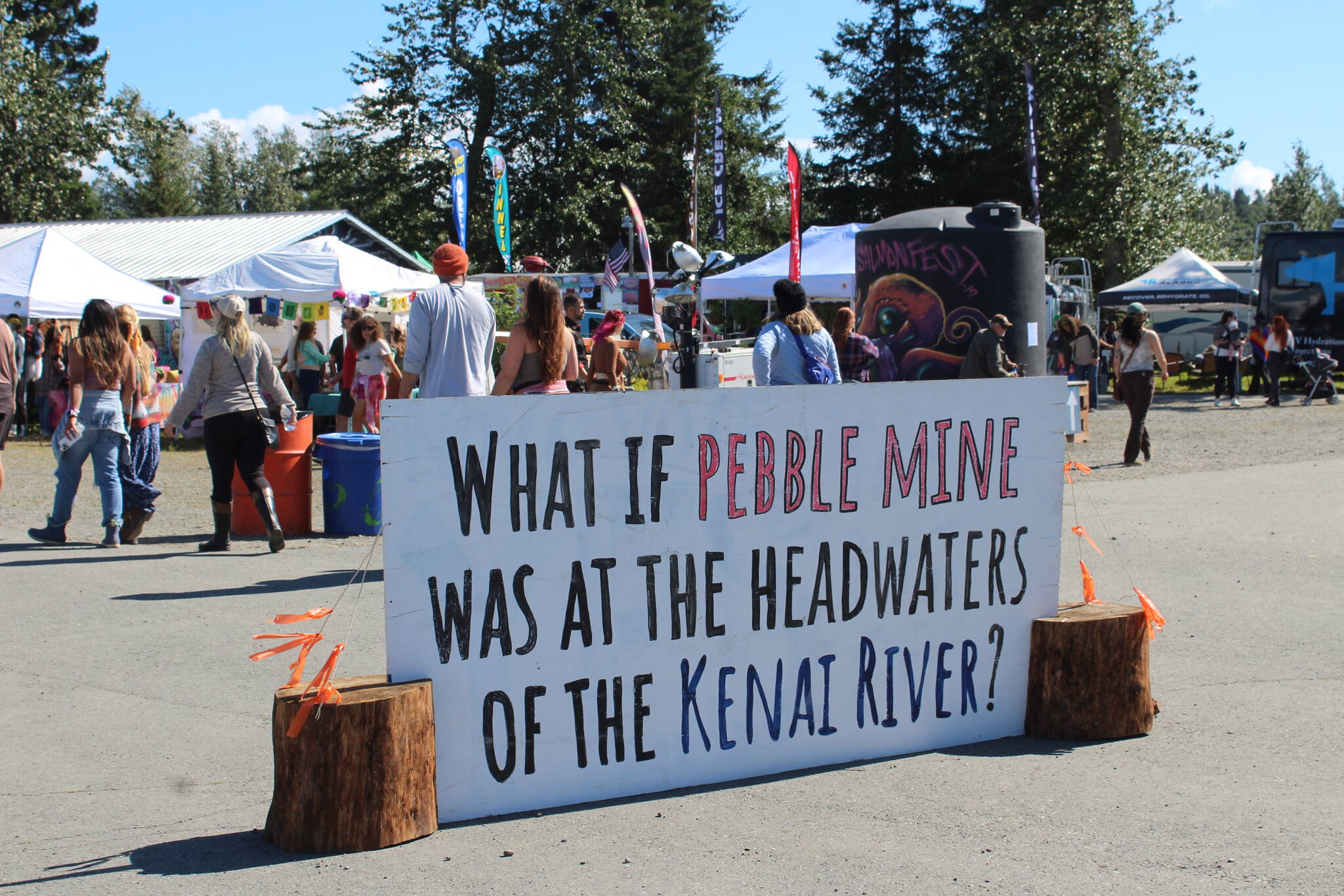 A sign welcomes patrons to Ninilchik, Alaska, on Friday, Aug. 5, 2022 for Salmonfest, an annual event that raises awareness about salmon-related causes. (Ashlyn O’Hara/Peninsula Clarion)