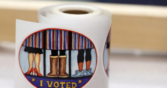 A roll of I voted stickers await voters on Saturday at the Alaska Division of Elections office in Juneau. A federal judge on Thursday denied a request to block campaign finance provisions of a ballot measure approved by Alaska voters in 2020. (Ben Hohenstatt / Juneau Empire File)