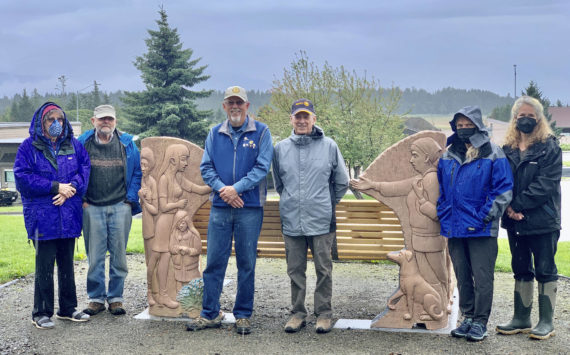 From left to right, Sara Murnane Berg, Ed Berg, Kim Zook, president of the Homer-Kachemak Bay Rotary Club, Bernie Griffard, past president, Linda Reinink-Smith, friend of Sara and Ed, Laura Kelley, treasurer, Homer-Kachemak Bay Rotary, pose for a photo on Tuesday, Aug. 9, after Zook presented the Bergs with a $2,000 check for the Loved & Lost Memorial Bench at the Homer Public Library in Homer, Alaska. (Photo provided)