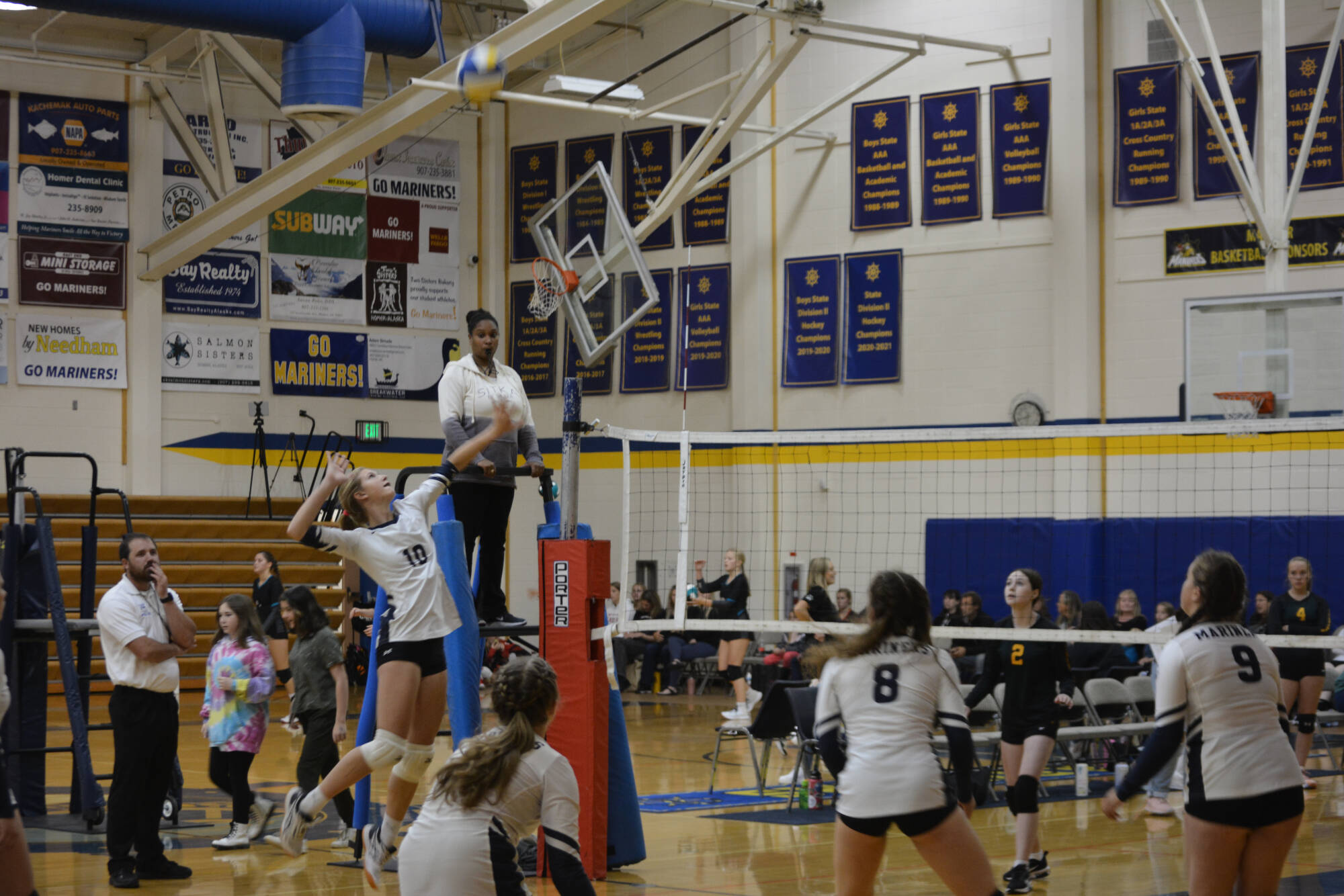 Junior Varsity player about to spike on Saturday, Aug. 20, 2022, at Homer High School in Homer, Alaska. (Photo by Charlie Menke/ Homer News)