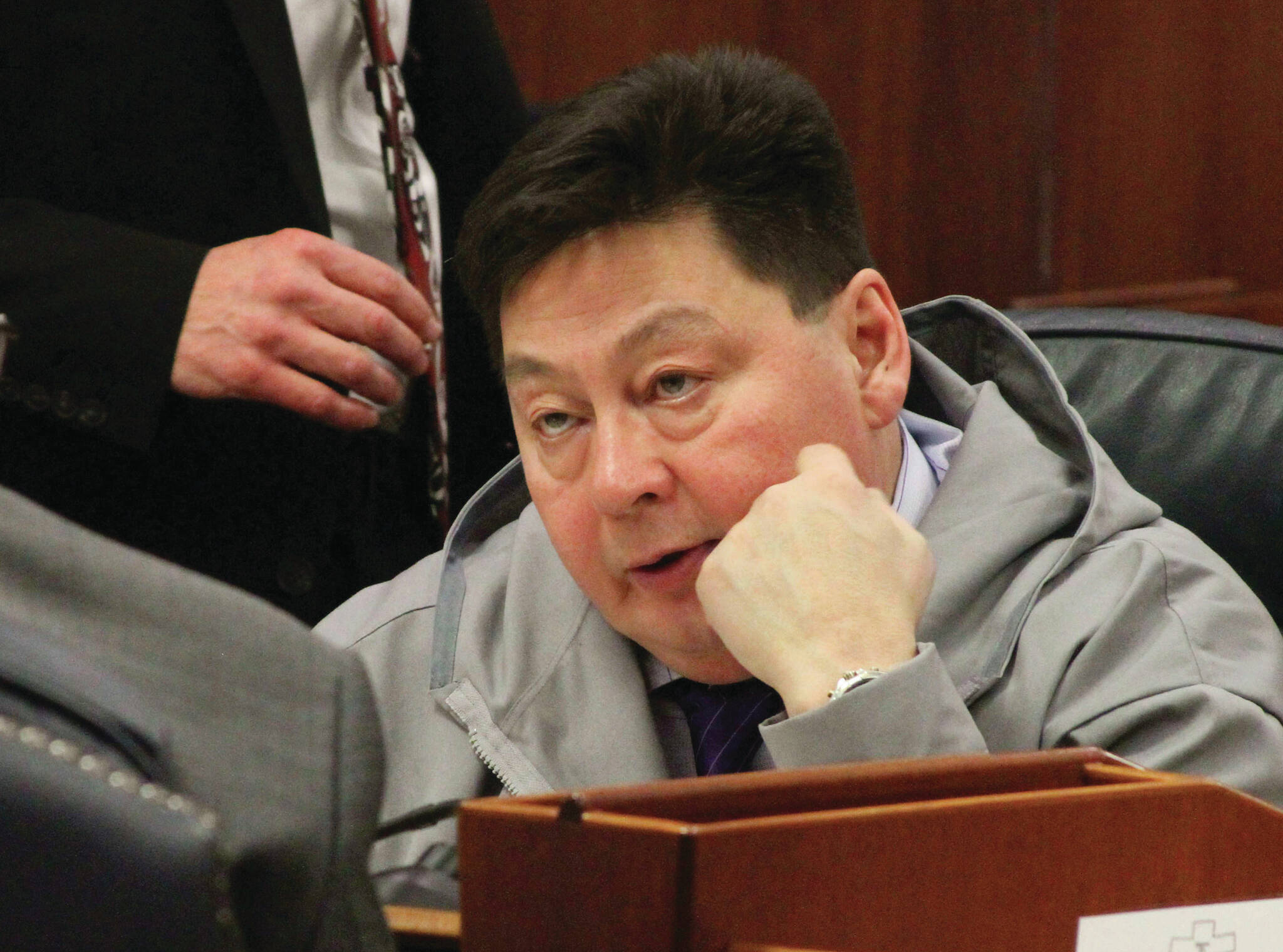 FILE - In this Jan. 17, 2017, file photo, state Rep. Dean Westlake, D-Kotzebue, talks with another legislator during a break in the opening session of the Alaska Legislature in Juneau, Alaska. The son of the former Alaska lawmaker faces charges of manslaughter and evidence tampering in death of his father, Rep. Dean Westlake, according to charging documents. Tallon Westlake was arrested over the weekend. An online court records system did not show an attorney Monday, Aug. 22, 2022 who could speak on his behalf. The charging documents are dated Sunday. (AP Photo/Mark Thiessen, File)