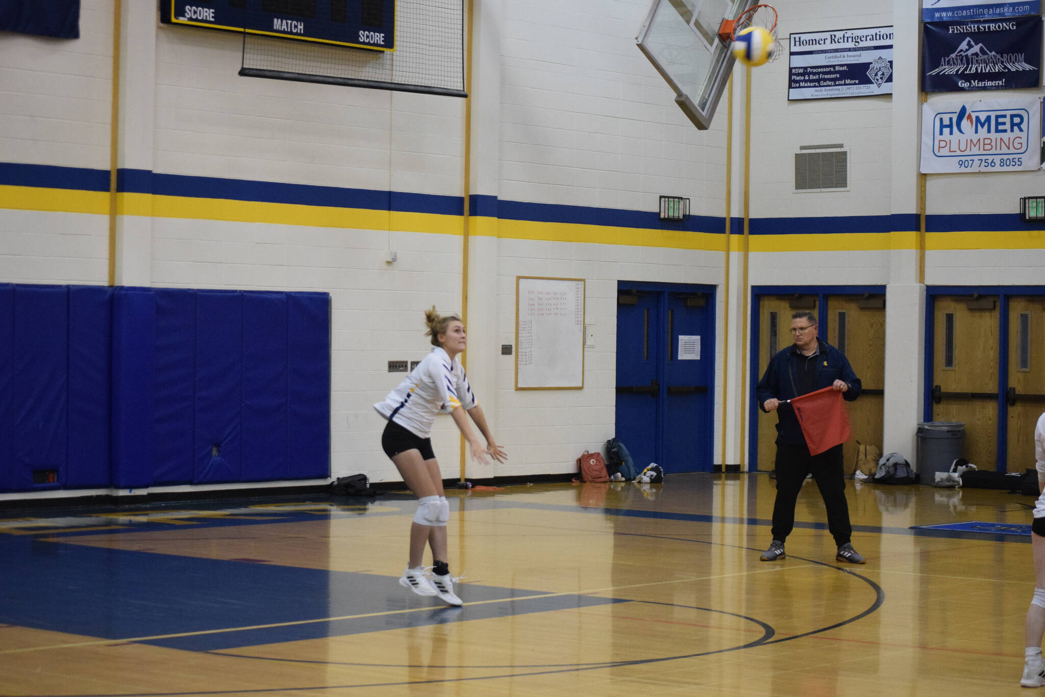 Junior Goldie Hill serves at Homer High School Alice Witte Gym on Wednesday, Aug. 24, 2022. (Photo by Charlie Menke/ Homer News)
