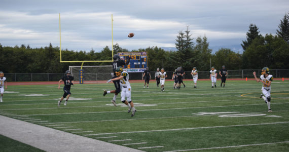 Senior Morgan Techie rises high to catch a 37-yard throw on Friday, Aug. 26 at Homer High School Field in Homer, Alaska. (Photo by Charlie Menke/Homer News)