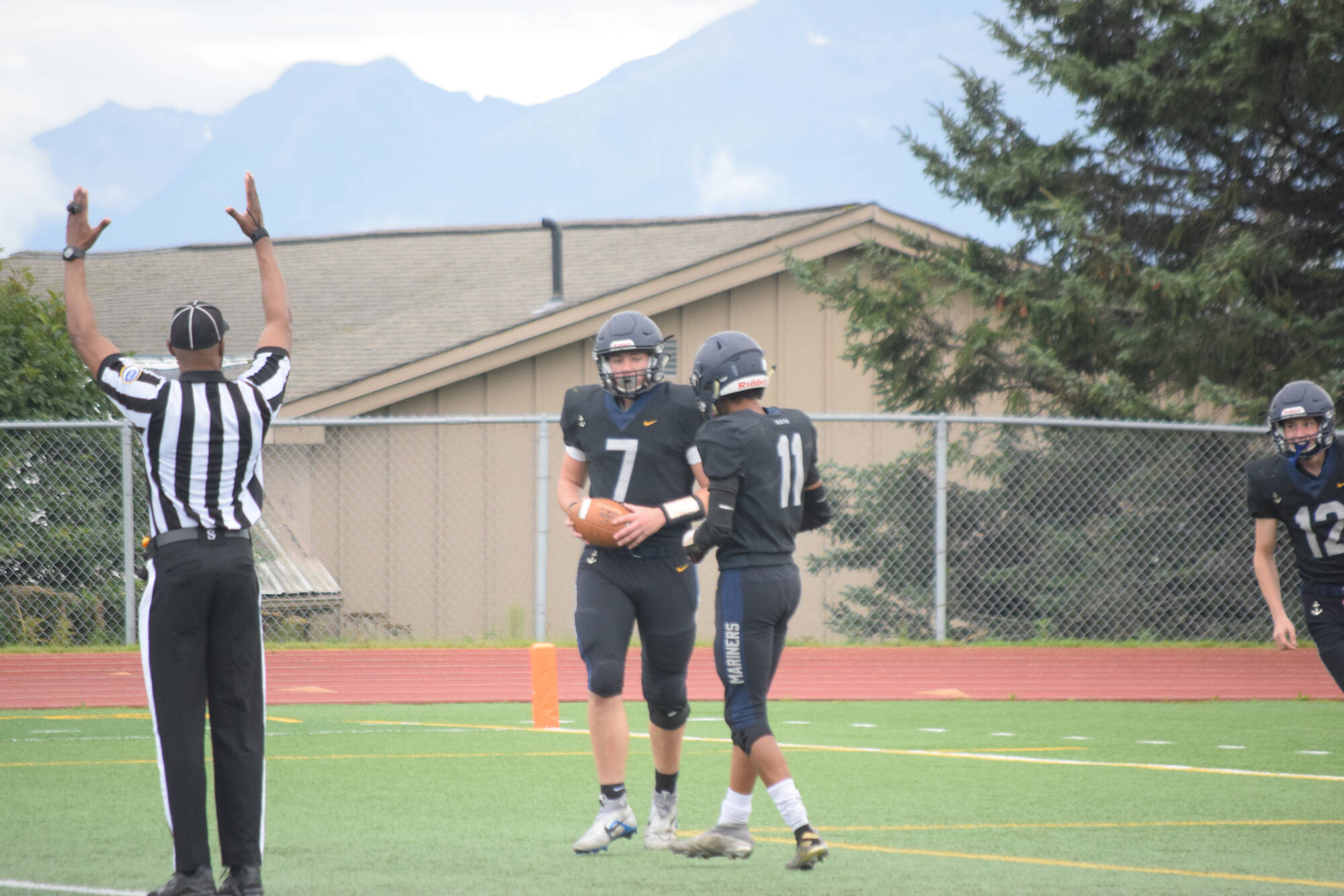 Carter Tennison and Morgan Techie celebrate a touchdown on Friday, Aug. 26 at Homer High School Field in Homer, Alaska. (Photo by Charlie Menke/Homer News)