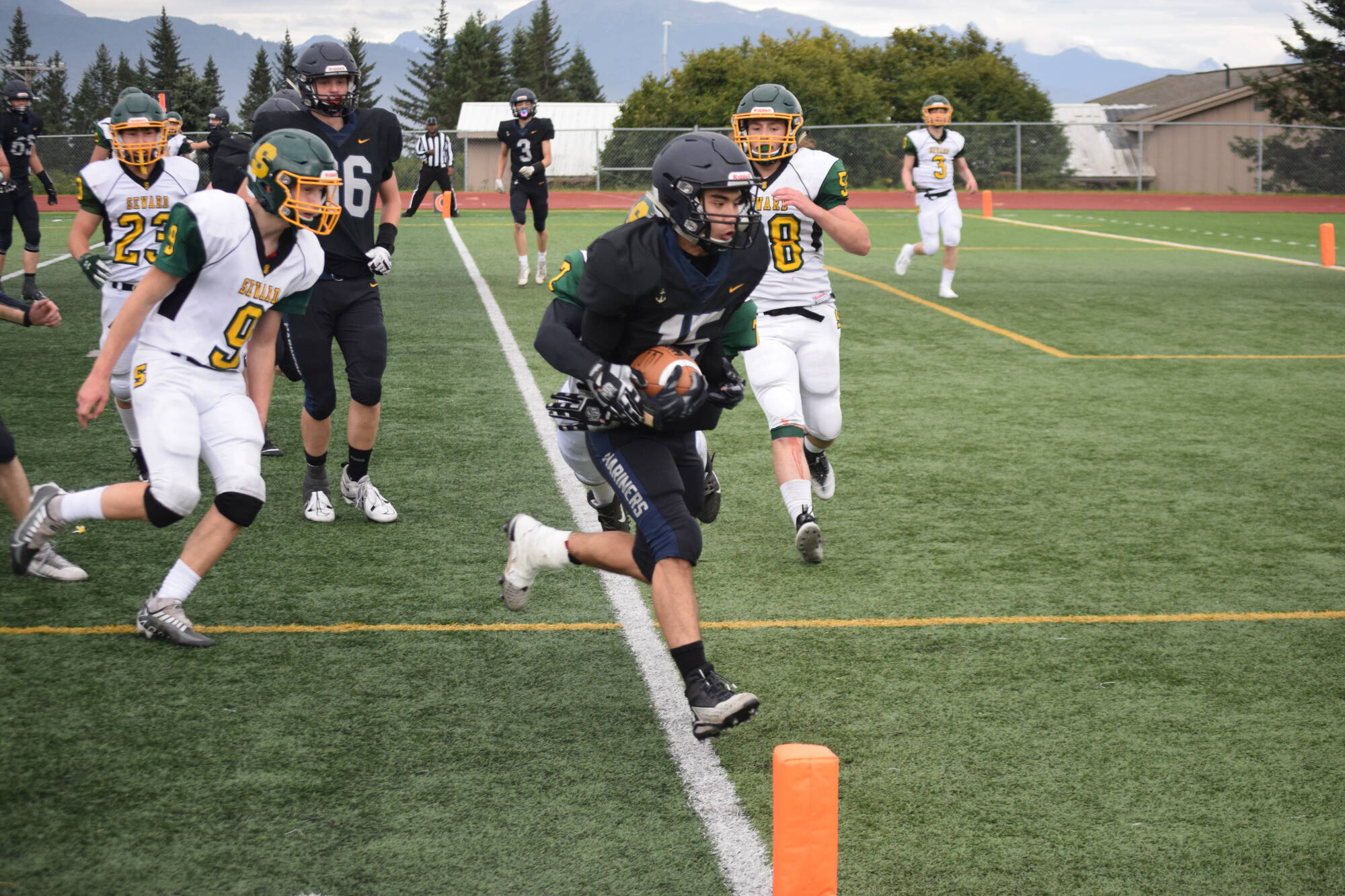 Senior Russell Nyball rushes to score a decisive touchdown on Friday, Aug. 26 at Homer High School Field in Homer, Alaska. (Photo by Charlie Menke/Homer News)