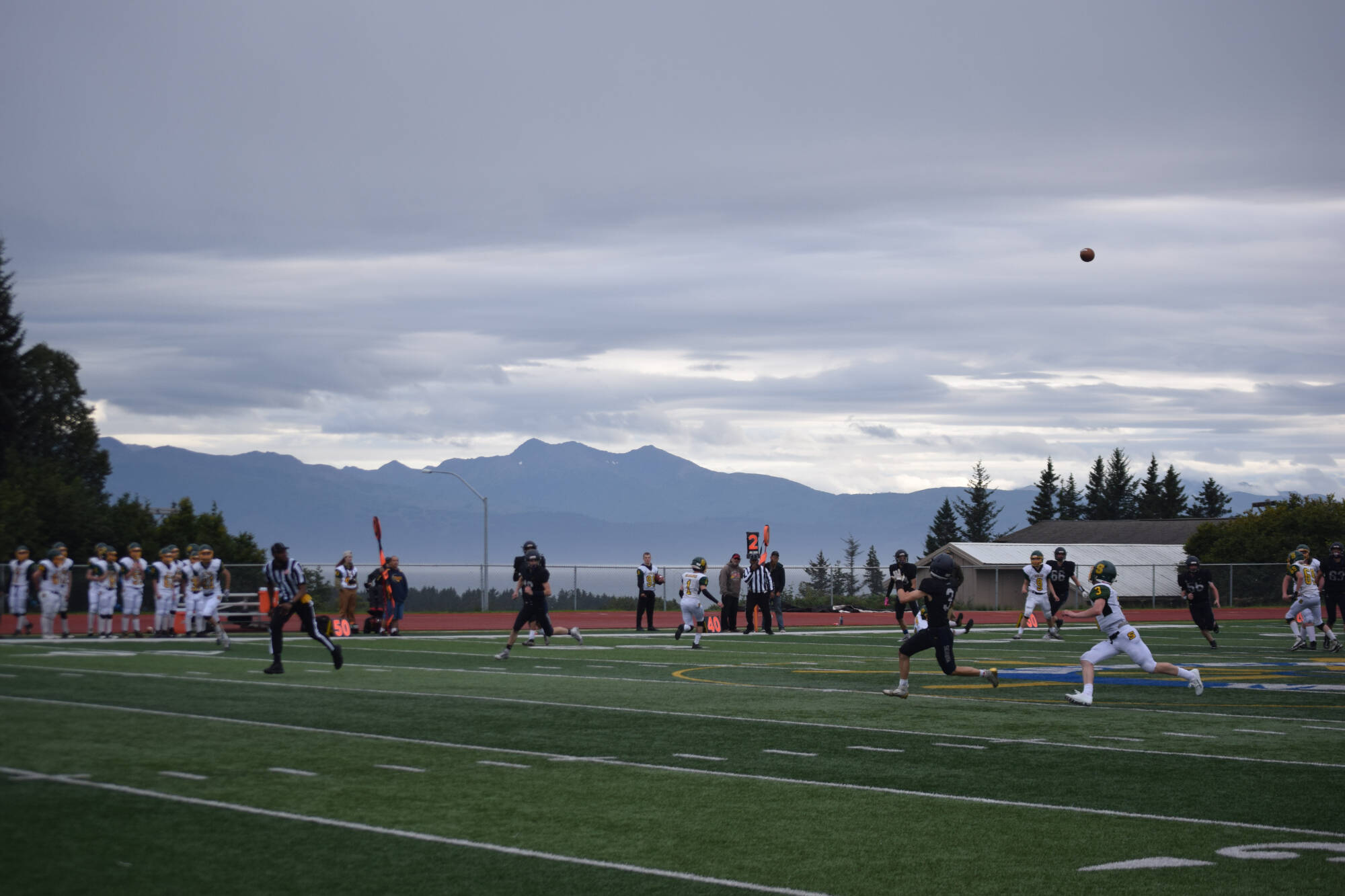 Junior Jonah Martin runs for a deep try on Friday, Aug. 26 at Homer High School Field in Homer, Alaska. (Photo by Charlie Menke/Homer News)