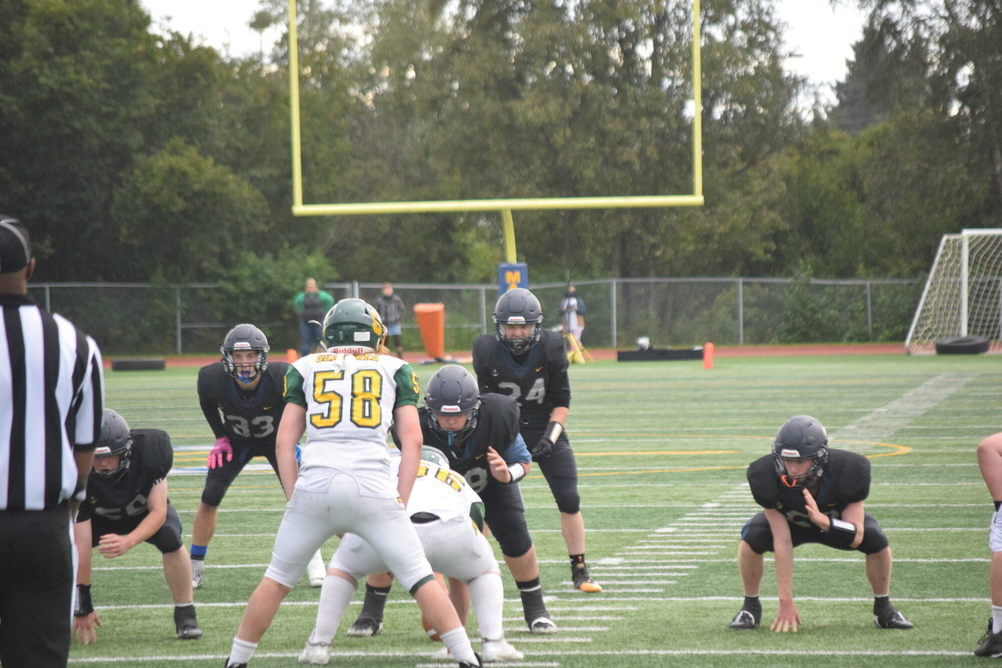 Sophomore Preston Stanislaw leads the offensive line on Friday, Aug. 26 at Homer High School Field in Homer, Alaska. (Photo by Charlie Menke/Homer News)