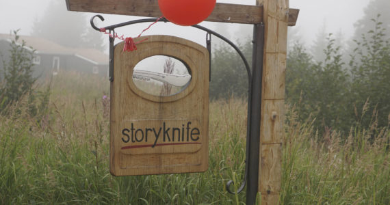 Fog rolls in over the sign for the Storyknife Writers Retreat at an open house on Monday, Aug. 29, 2022, near Homer, Alaska. (Photo by Michael Armstrong/Homer News)