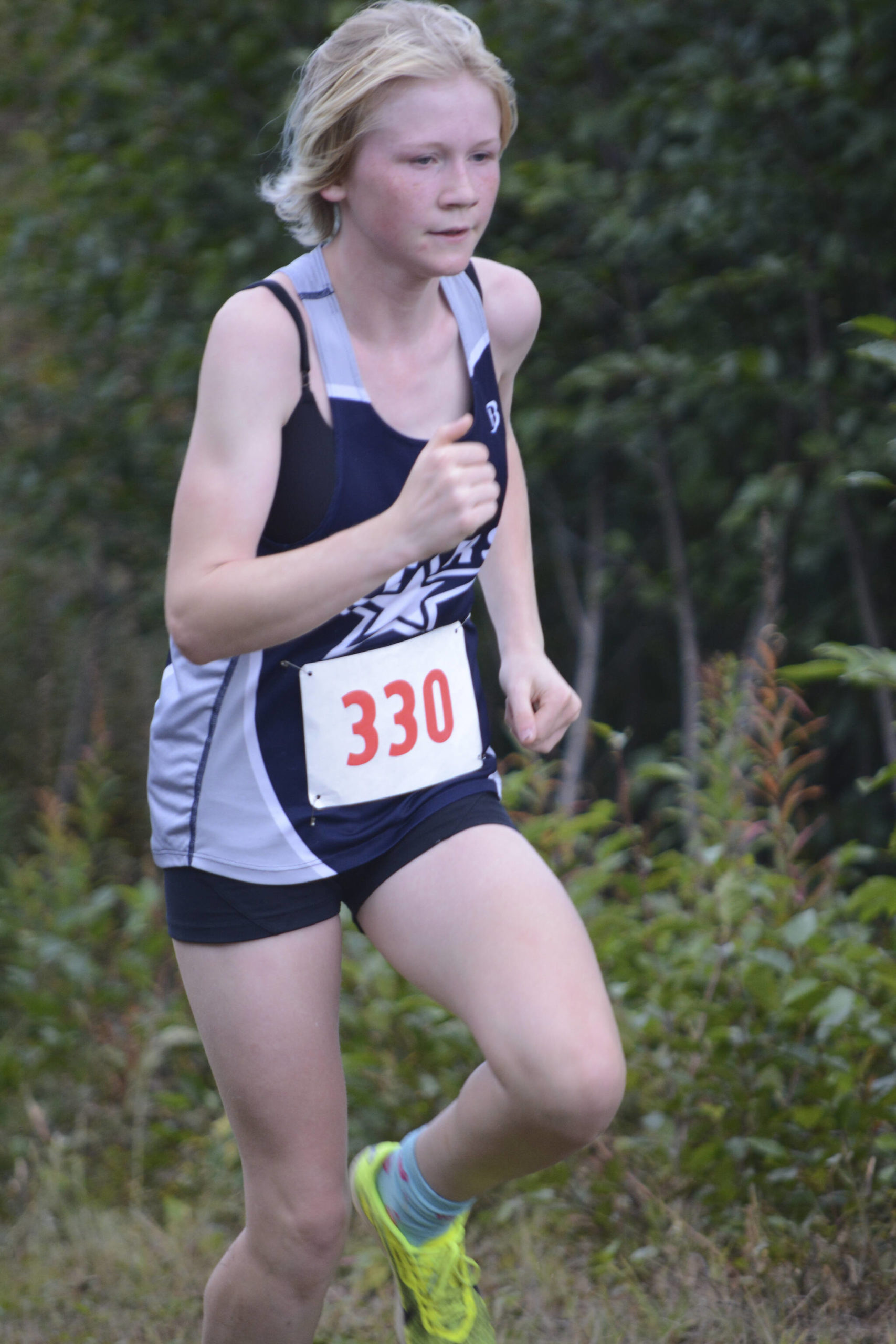 Soldotna’s Sophia Jedlicki heads toward the finish line for third place in the Homer Invite on Friday, Sept. 2, 2022, at the Lookout Mountain Trails near Homer, Alaska. (Photo by Michael Armstrong/Homer News)