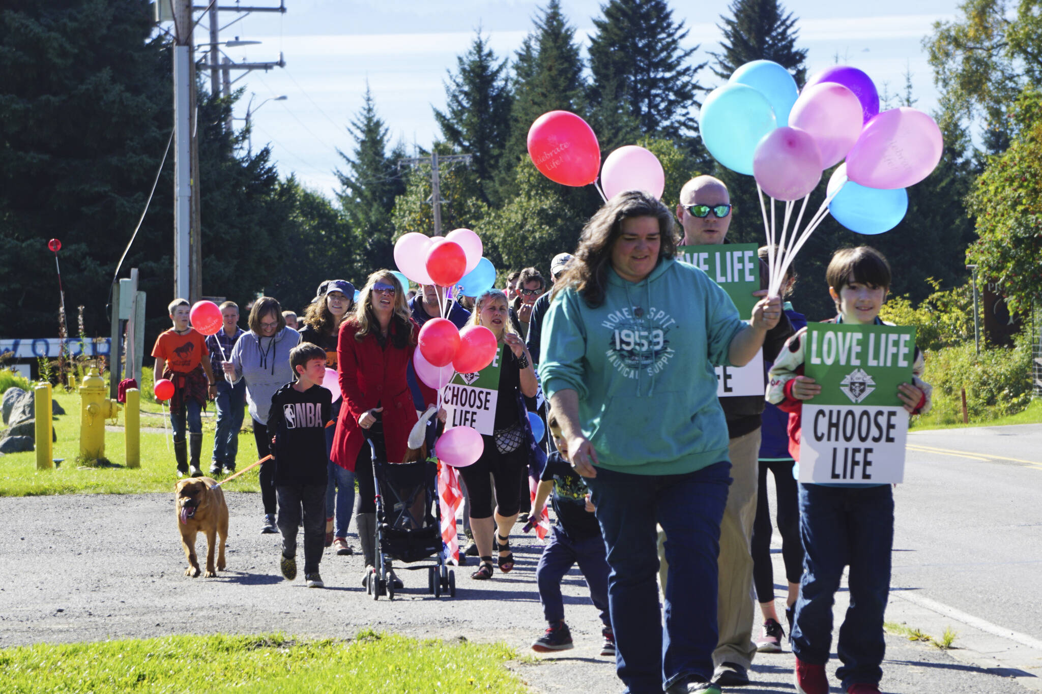 Photo by Michael Armstrong/Homer News
People with Walk for Life march up Bartlett Street to the Water’s Edge crisis pregnancy clinic on Monday, Sept. 5, 2022, in Homer, Alaska. About 140 people walked from the Assembly of God Church and Glacier View Baptist Church on East End Road along Pioneer Avenue and up Bartlett Street to show their support for pro-life efforts and opposition to abortion.
