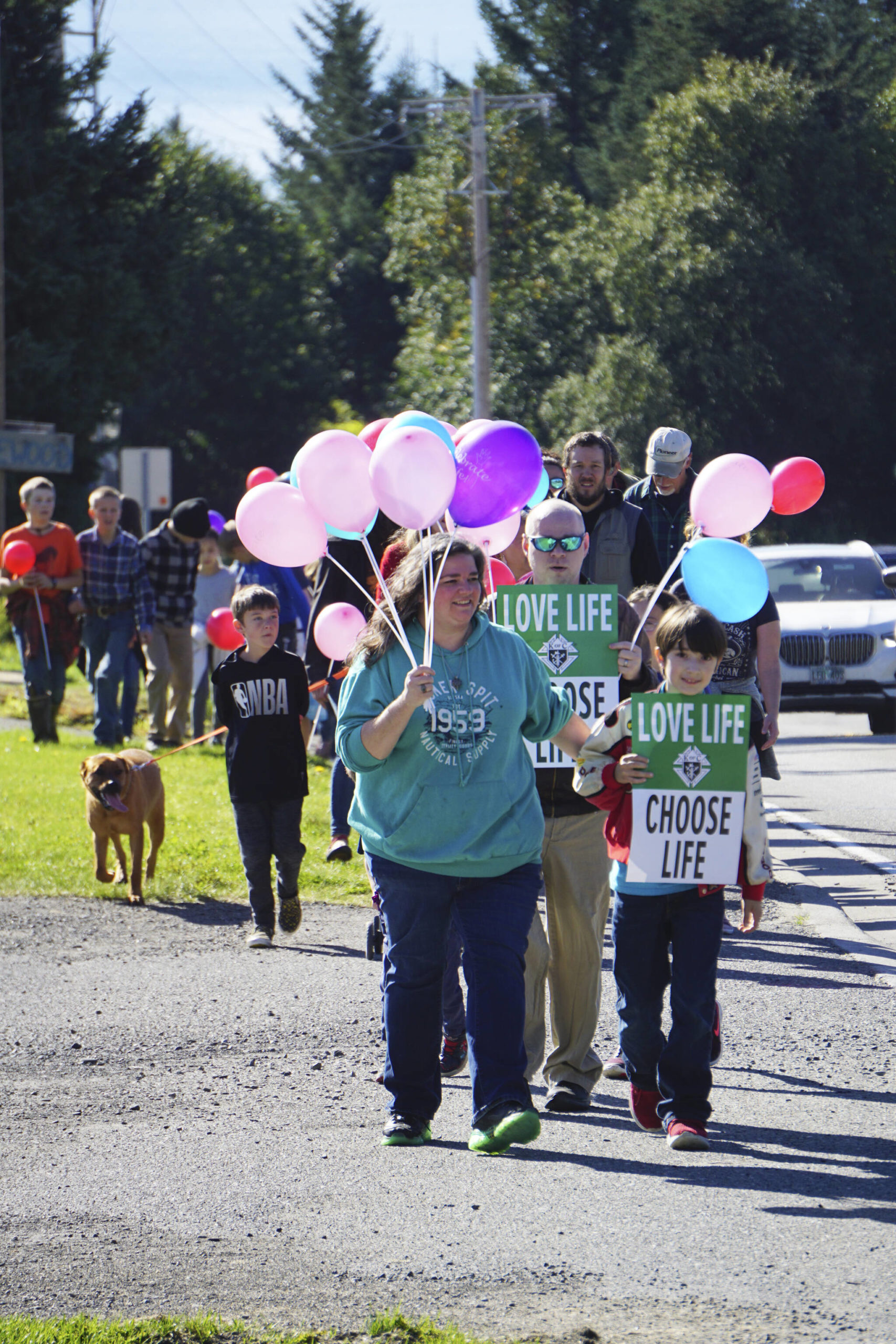 People with Walk for Life march up Bartlett Street to the Water’s Edge crisis pregnancy clinic on Monday, Sept. 5, 2022, in Homer, Alaska. About 140 people walked from the Assembly of God Church and Glacier View Baptist Church on East End Road along Pioneer Avenue and up Bartlett Street to show their support for pro-life efforts and opposition to abortion. (Photo by Michael Armstrong/Homer News)