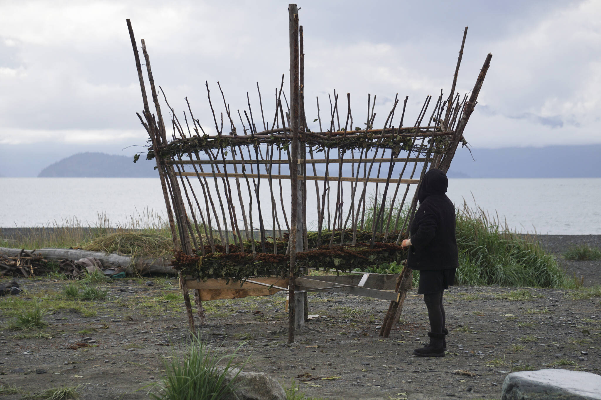 Burning Basket coordinator Mavis Muller, works on this this year’s Burning Basket, Breathe, on Tuesday, Sept. 6, 2022, at Mariner Park on the Homer Spit in Homer, Alaska. (Photo by Michael Armstrong/Homer News)