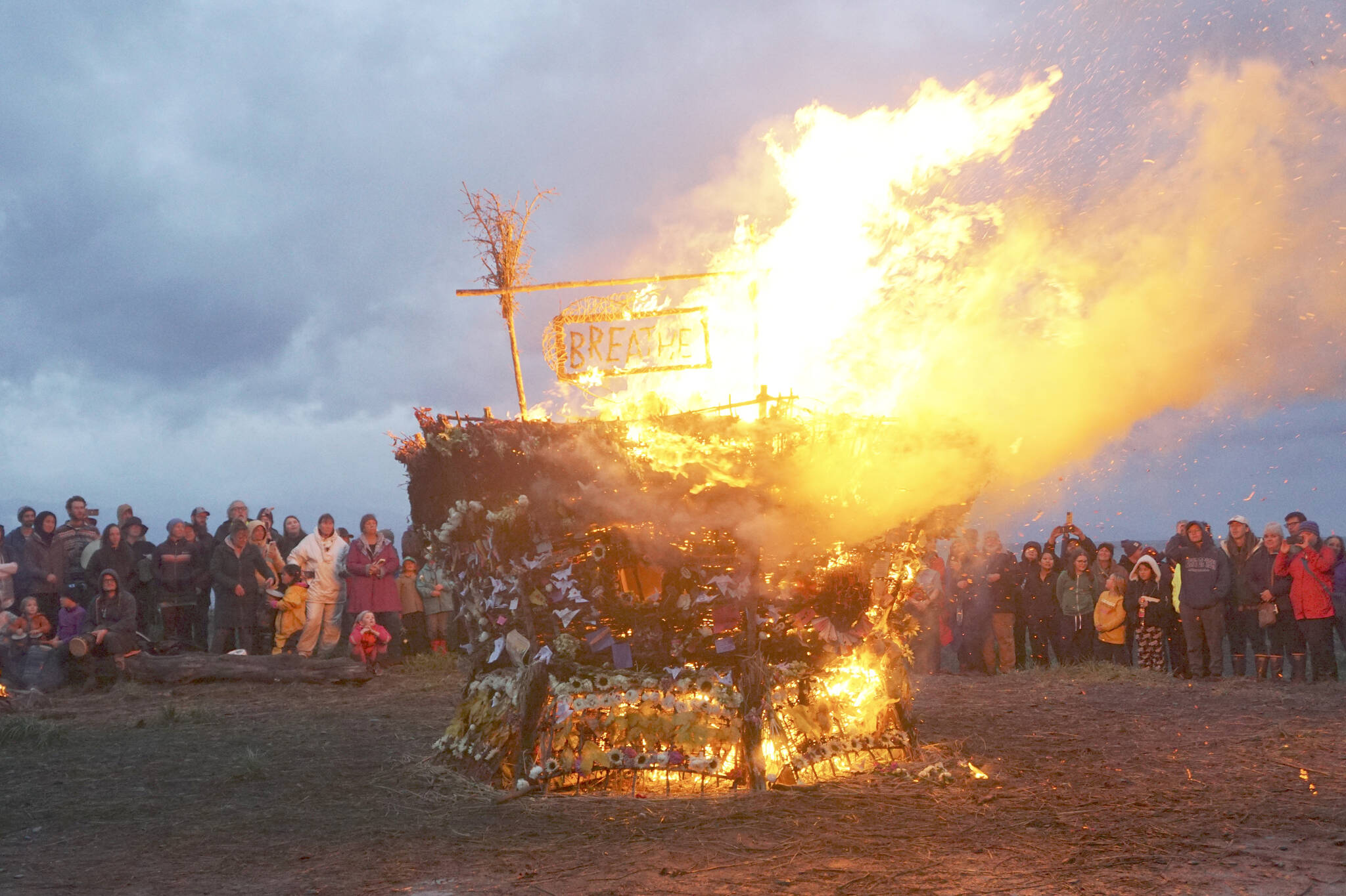 As about 200 people watch, the 19th annual Burning Basket, “Breathe,” catches fire on Sunday, Sept. 11, 2022, at Mariner Park on the Homer Spit in Homer, Alaska. (Photo by Michael Armstrong/Homer News)