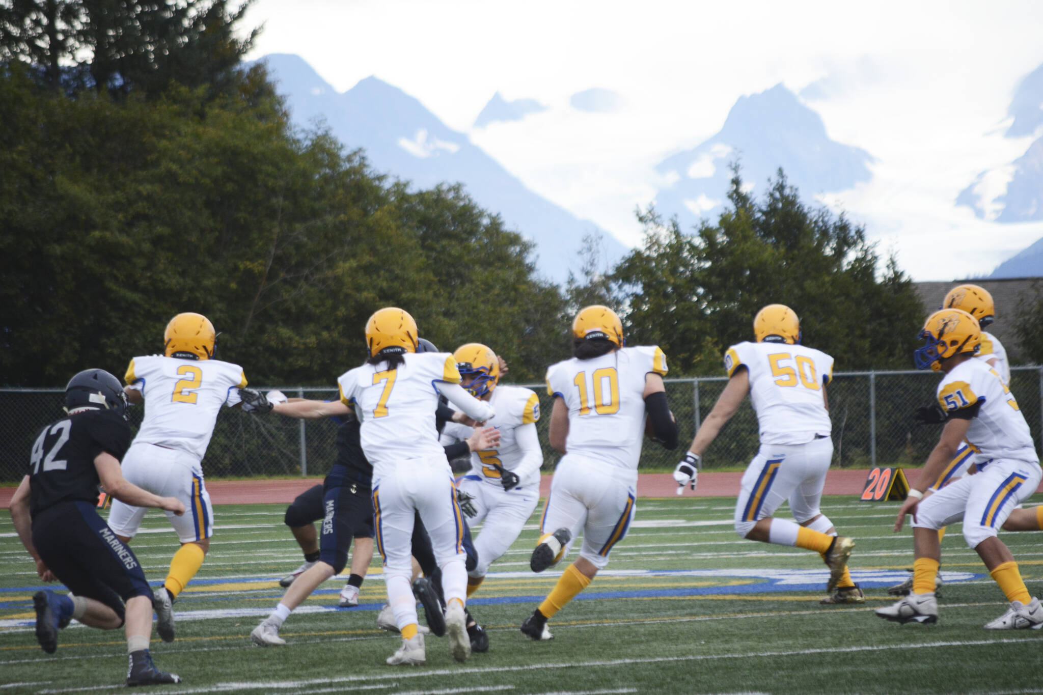 Barrow Whaler Kolo Danner sneaks past the Homer Mariner defense at the Homer homecoming game on Friday, Sept. 12, 2022, in Homer, Alaska. (Photo by Michael Armstrong/Homer News)