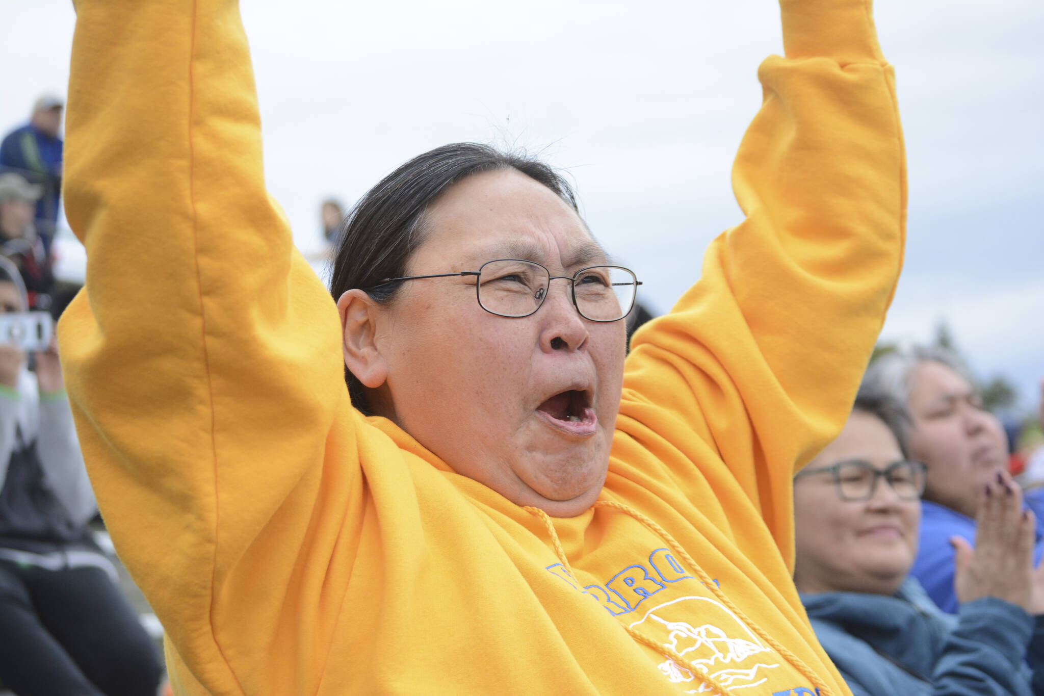Stella Scott cheers as the Barrow Whalers of Utqiagvik make a touchdown on Friday, Sept. 16, 2022, at the Mariners vs. Whalers football game at Homer High School in Homer, Alaska. Scott lives in Homer, but her home town is Utqiagvik and she came to support the team with visiting residents from the farthest north Alaska city. (Photo by Michael Armstrong/Homer News)