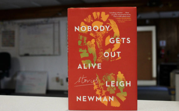 A copy of "Nobody Gets Out Alive" stands on a desk inside The Peninsula Clarion's offices on Tuesday, Aug. 30, 2022 in Kenai, Alaska. (Ashlyn O'Hara/Peninsula Clarion)