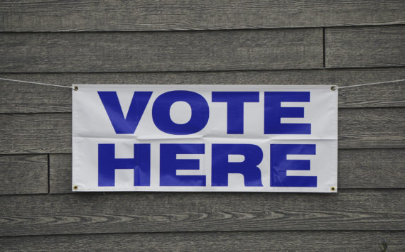 A banner at Homer City Hall identifies the building as a voting precinct. Early voting runs at city hall from 8 a.m. to 5 p.m. today, Friday and Monday in Homer, Alaska. (Photo by Michael Armstrong/Homer News)