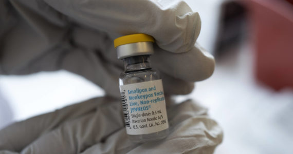 Registered pharmacist Sapana Patel holds a bottle of Monkeypox vaccine at a Pop-Up Monkeypox vaccination site on Wednesday, Aug. 3, 2022, in West Hollywood, Calif. (AP Photo/Richard Vogel, File)