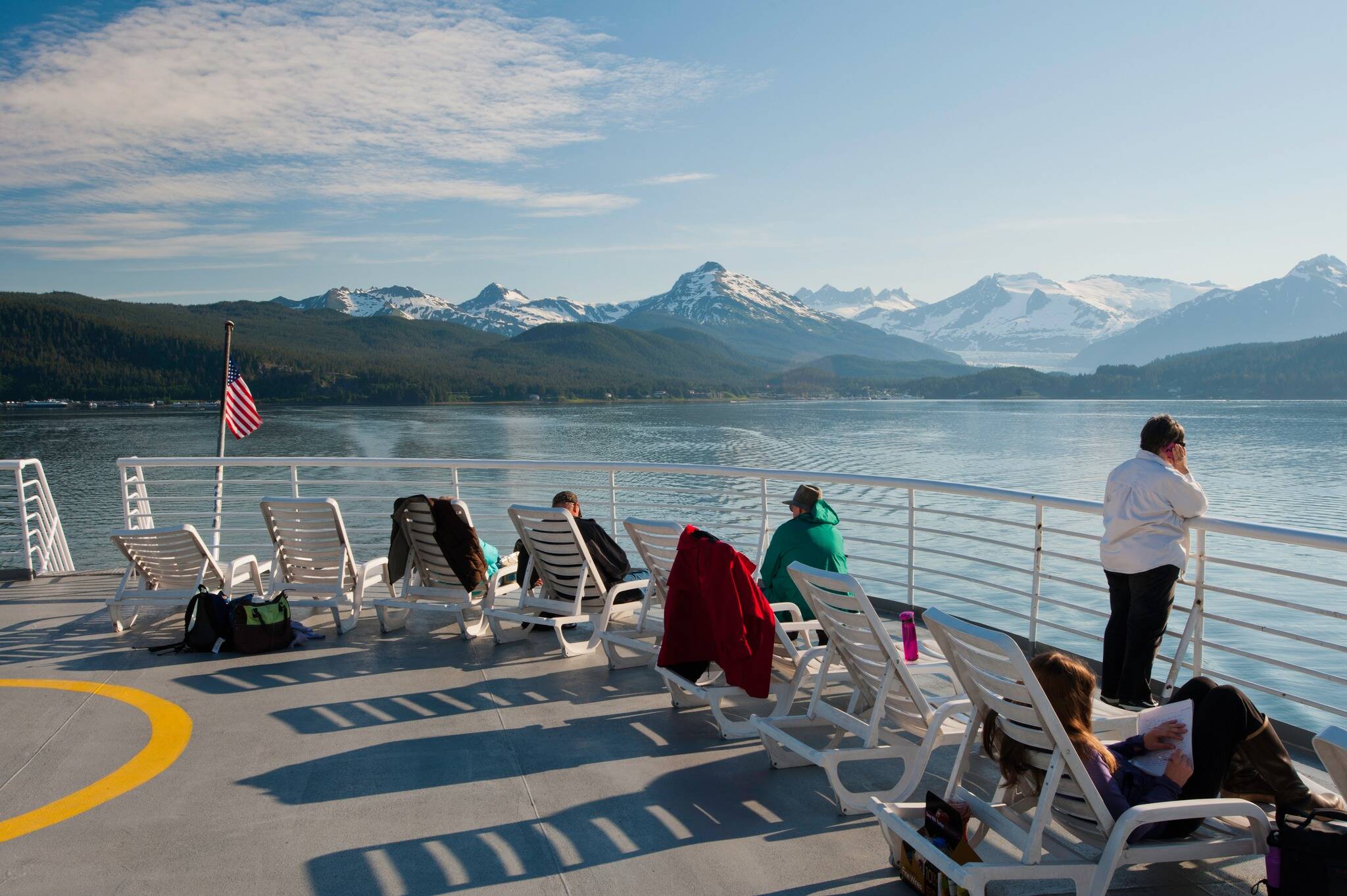 Passengers lounge on the dock of an Alaska Marine Highway System ferry as it departs Juneau in this photo posted Sept. 1 at the AMHS Facebook page. (Alaska State Department of Transportation and Public Facilities)