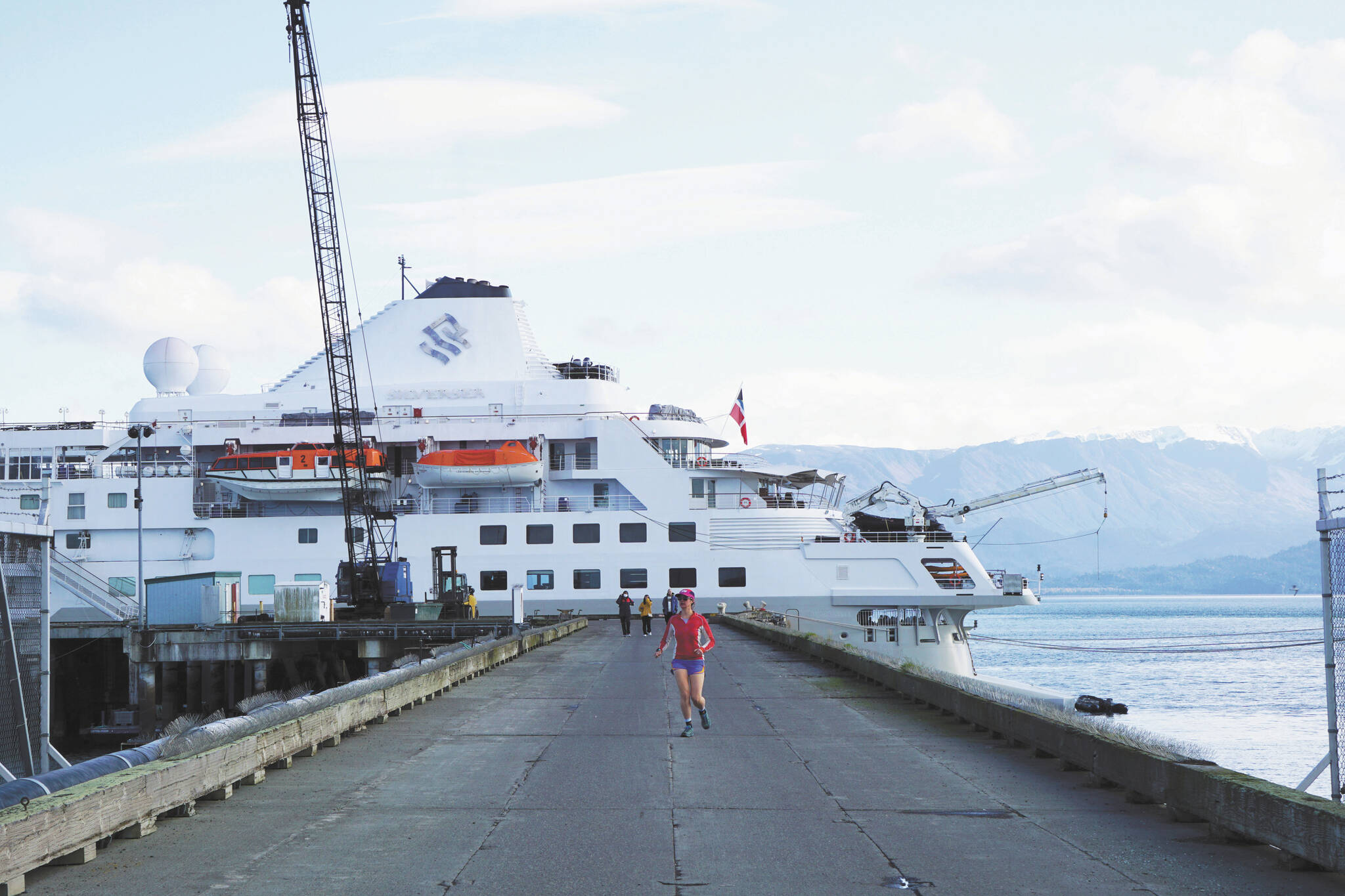 Photo by Michael Armstrong/Homer News
A jogger leaves the Silversea cruise ship Silver Wind at the Deep Water Dock on Sunday, Sept. 25, in Homer.