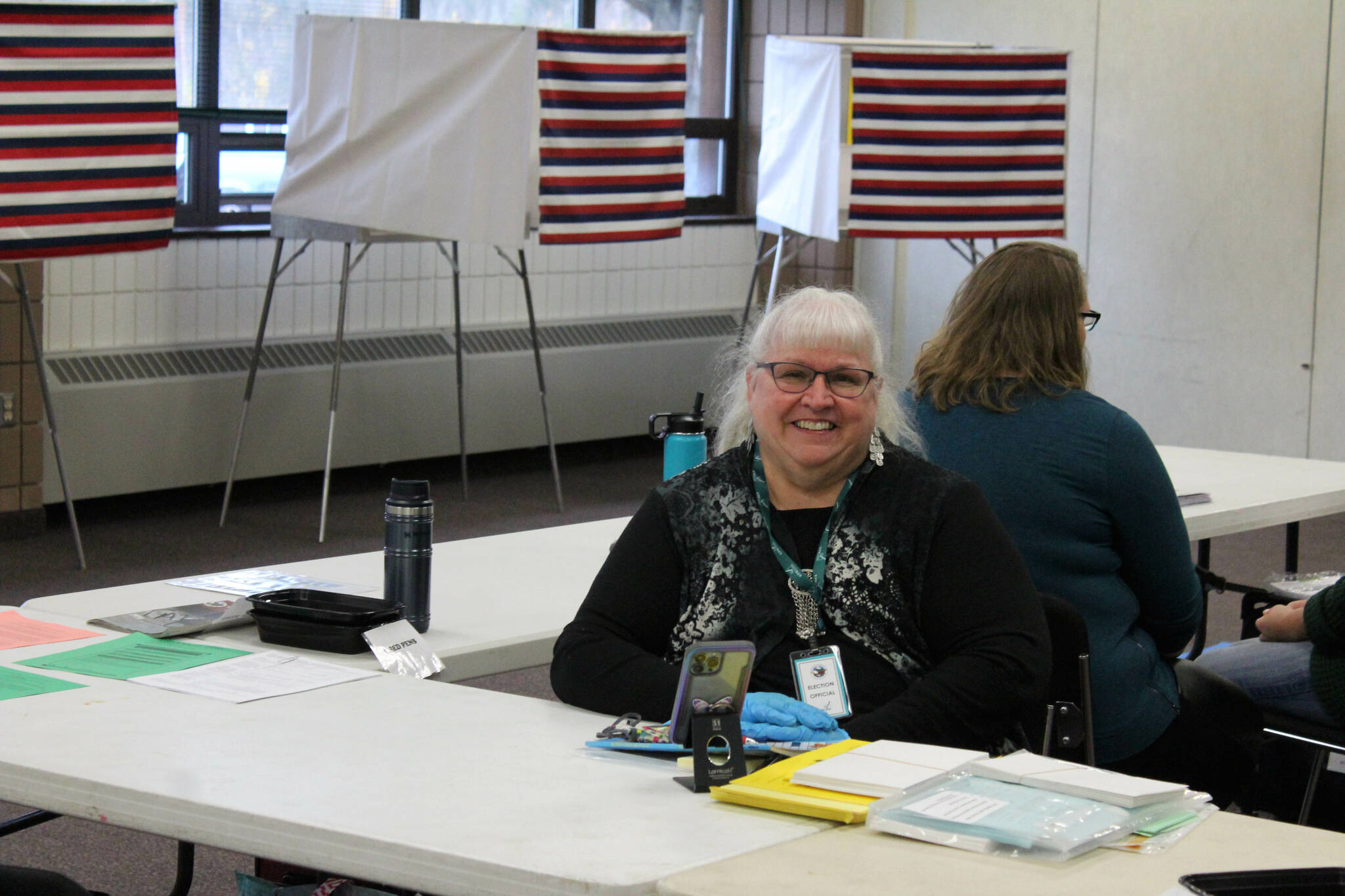 Kathy Carson helps run a polling location at the Soldotna Regional Sports Complex on Tuesday, Oct. 4, 2022, in Soldotna, Alaska. (Ashlyn O’Hara/Peninsula Clarion)