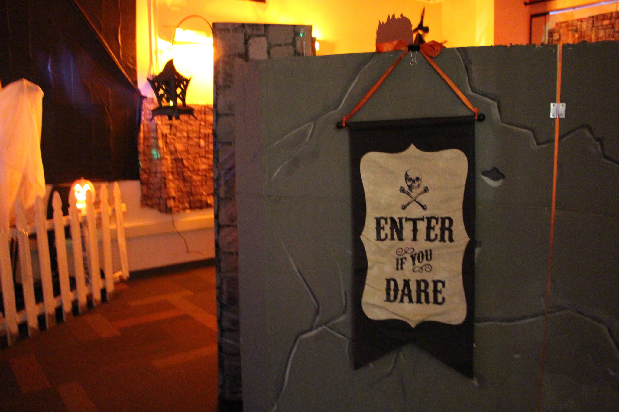 A sign welcoming visitors to the Literary Haunted House at the Kenai Community Library can be seen here on Oct. 30, 2019. (Photo by Brian Mazurek/Peninsula Clarion)