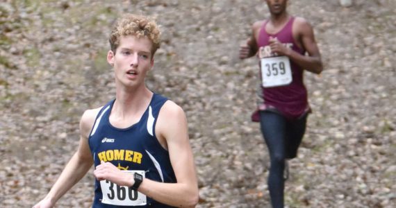 Homer's Seamus McDonough leads the Division II boys race at the state cross-country meet Saturday, Oct. 8, 2022, at Bartlett High School in Anchorage, Alaska. (Photo by Jeff Helminiak/Peninsula Clarion)