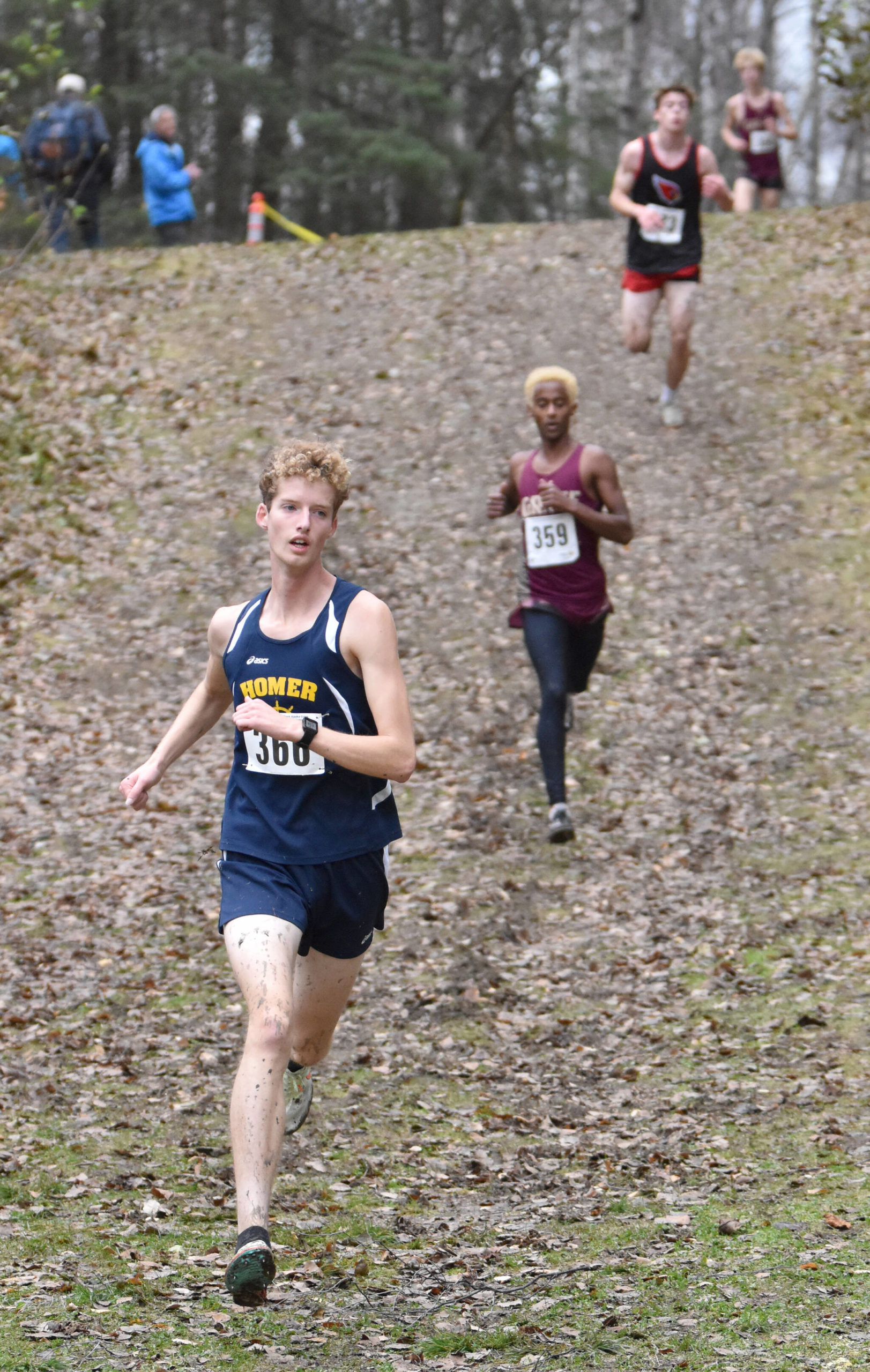 Homer’s Seamus McDonough leads the Division II boys race at the state cross-country meet Saturday, Oct. 8, 2022, at Bartlett High School in Anchorage, Alaska. (Photo by Jeff Helminiak/Peninsula Clarion)