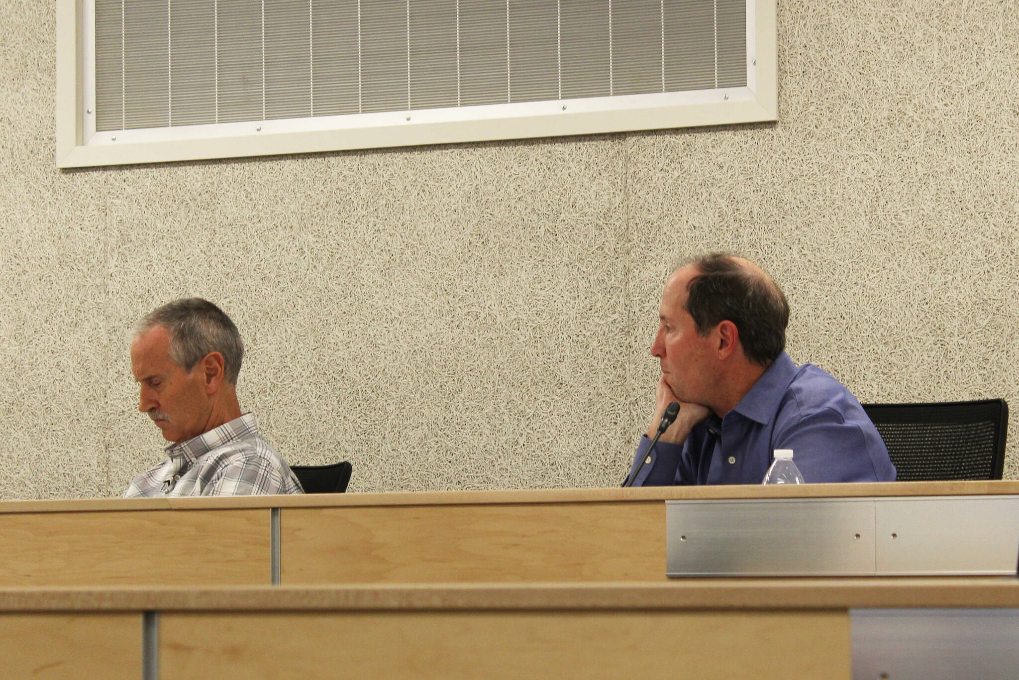 Kenai Peninsula Borough Mayor Mike Navarre (right) and Chief of Staff Max Best (left) participate in an assembly meeting on Tuesday, Oct. 11, 2022 in Soldotna, Alaska. The meeting was Navarre’s first as mayor since being appointed last month. (Ashlyn O’Hara/Peninsula Clarion)