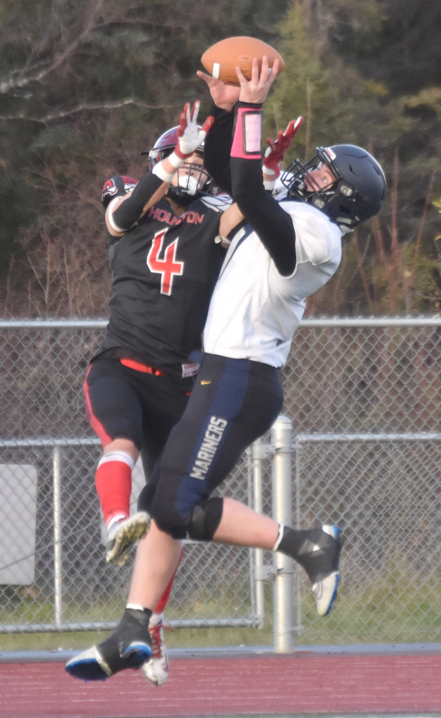 Homer’s Carter Tennison breaks up a pass intended for Houston’s Hayden Howard on Saturday, Oct. 15, 2022, in the Division III state championship game at Service High School in Anchorage, Alaska. (Photo by Jeff Helminiak/Peninsula Clarion)
