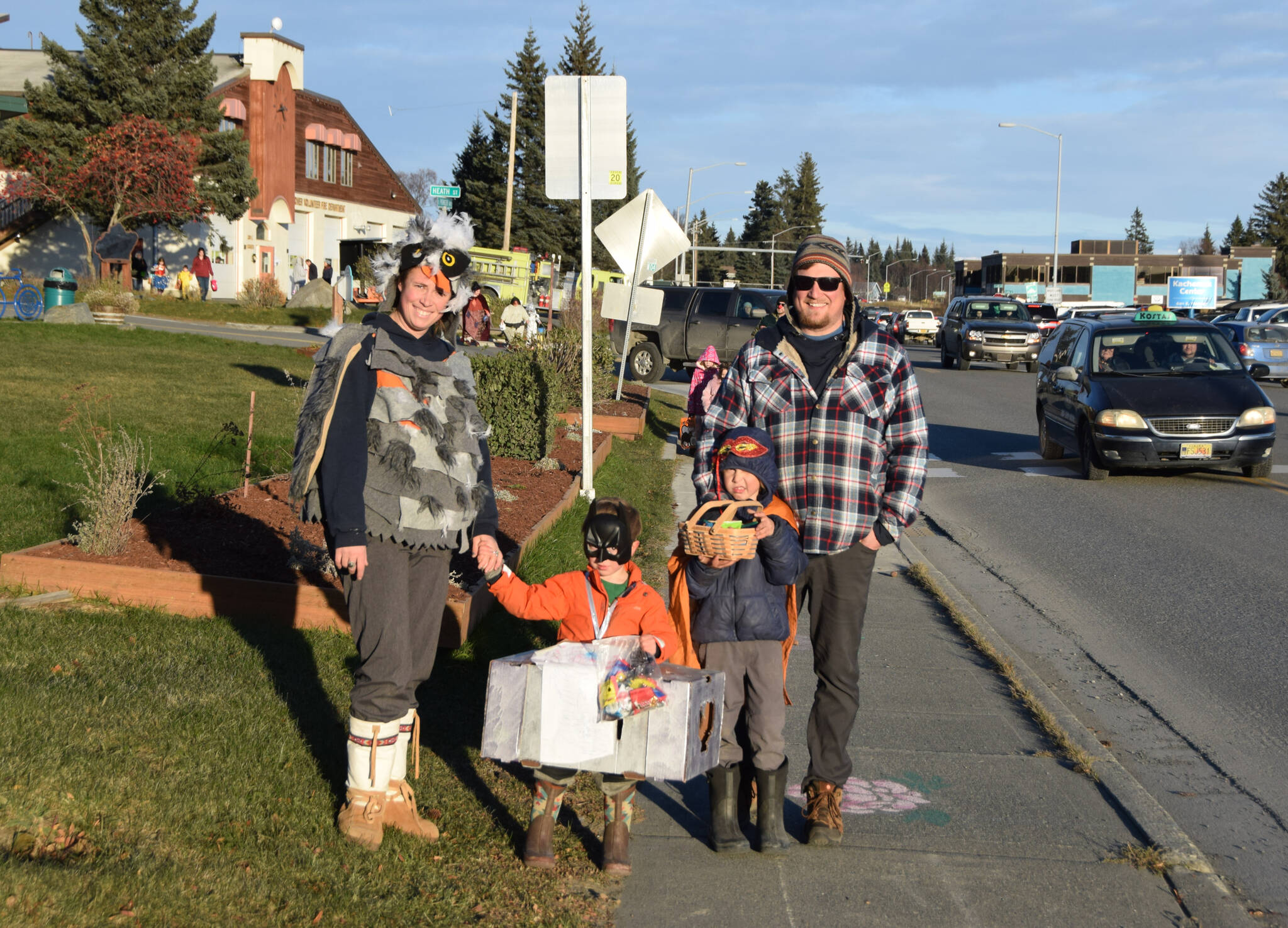 Kids show of their candy during the Homer Chamber of Commerce’s first annual Pioneer Avenue Trick-or-Treat event on Monday, Oct. 31 in Homer, Alaska. (Photo by Charlie Menke / Homer News)
