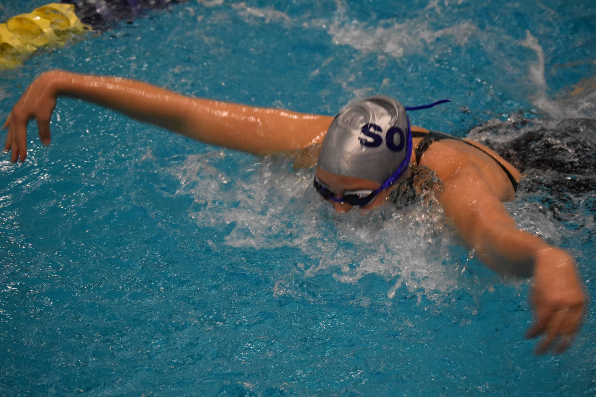 Soldotna’s Charisma Watkins swims the 100-yard butterfly during finals at the ASAA State Swim & Dive Championships on Saturday, Nov. 5, 2022, at Bartlett High School in Anchorage, Alaska. (Jake Dye/Peninsula Clarion)