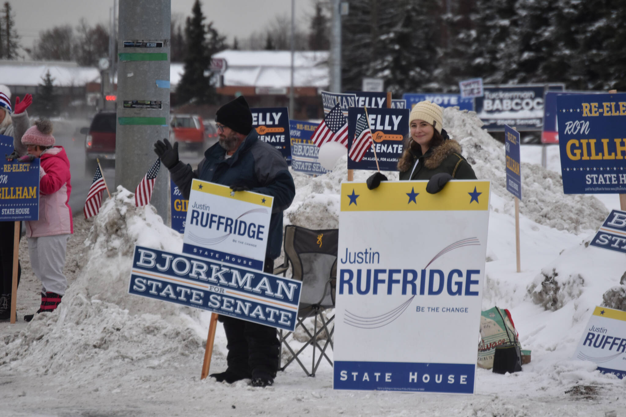 Michael O'Rourke and another supporter wave signs for Justin Ruffridge on Election Day, Nov. 8, 2022 in Kenai, Alaska. (Jake Dye/Peninsula Clarion)