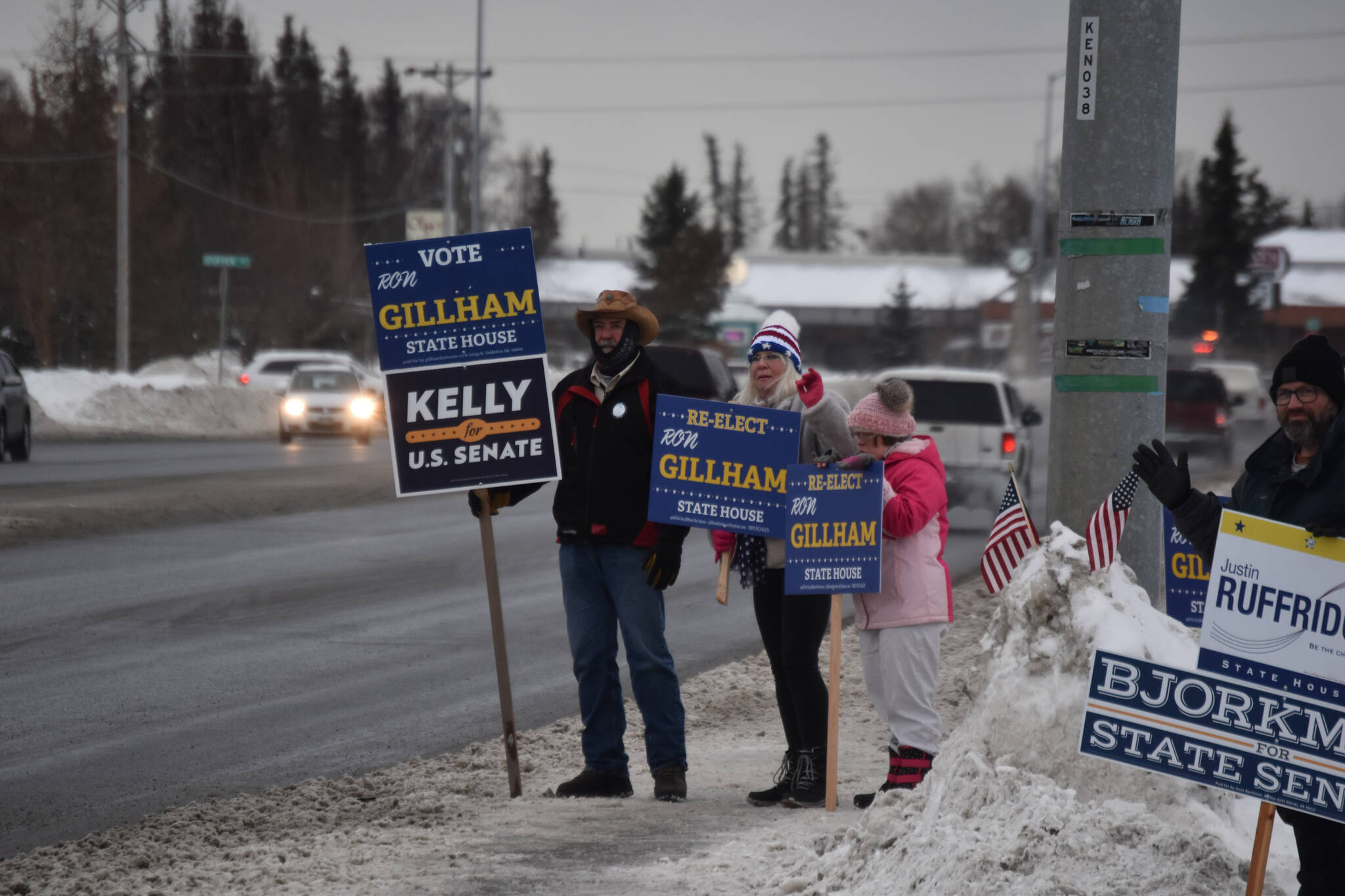 Candidate Ron Gillham,and his family are seen on Election Day, Nov. 8, 2022, at the intersection of the Kenai Spur Highway and Bridge Access Road in Kenai, Alaska. (Jake Dye/Peninsula Clarion)