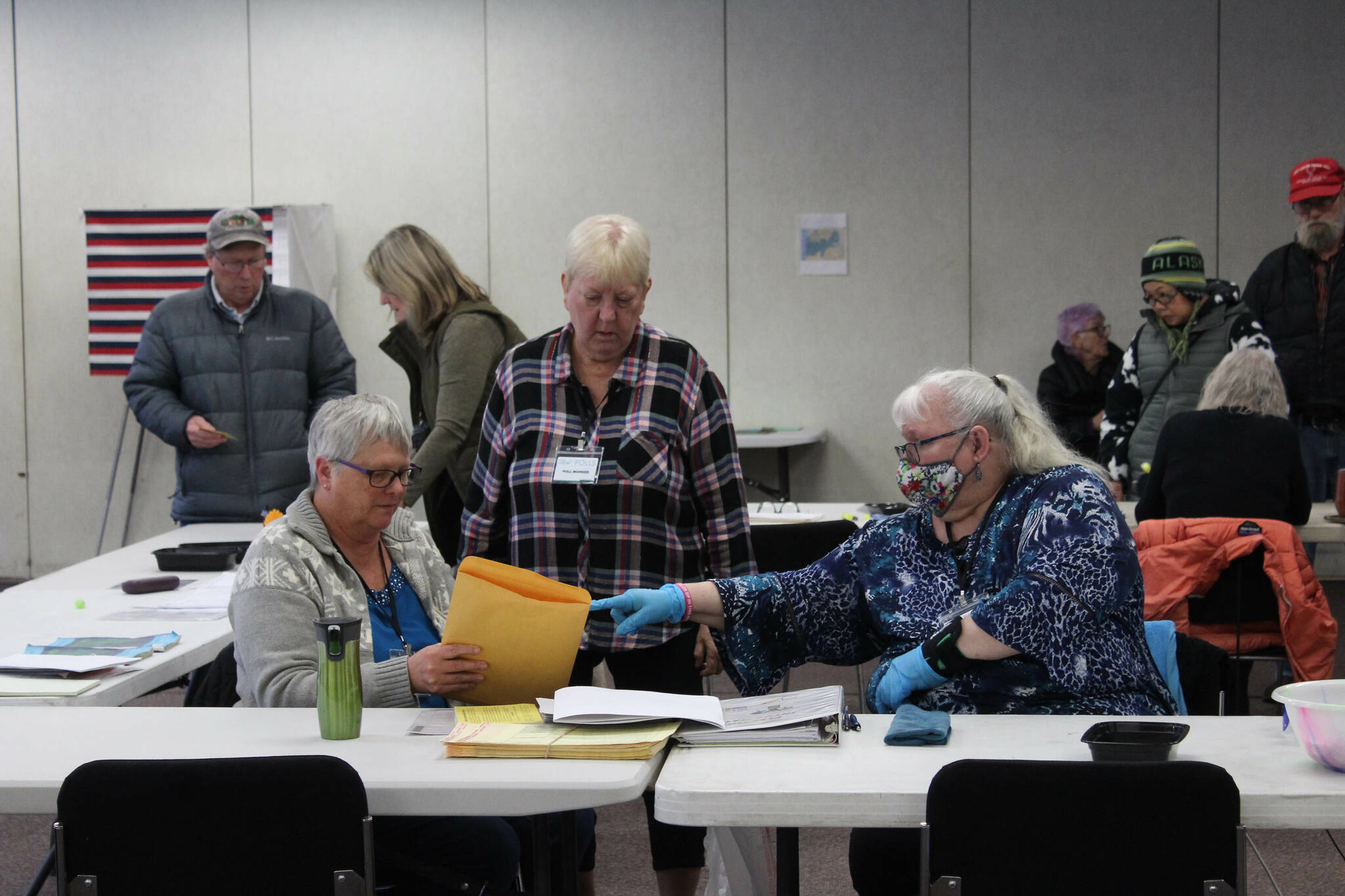 K-Beach Precinct Chair Kathy Carson (right) assists Carol Louthan (left) with a folder of spoiled ballots at the Soldotna Regional Sports Complex on Tuesday, Nov. 8, 2022 in Soldotna, Alaska. (Ashlyn O'Hara/Peninsula Clarion)