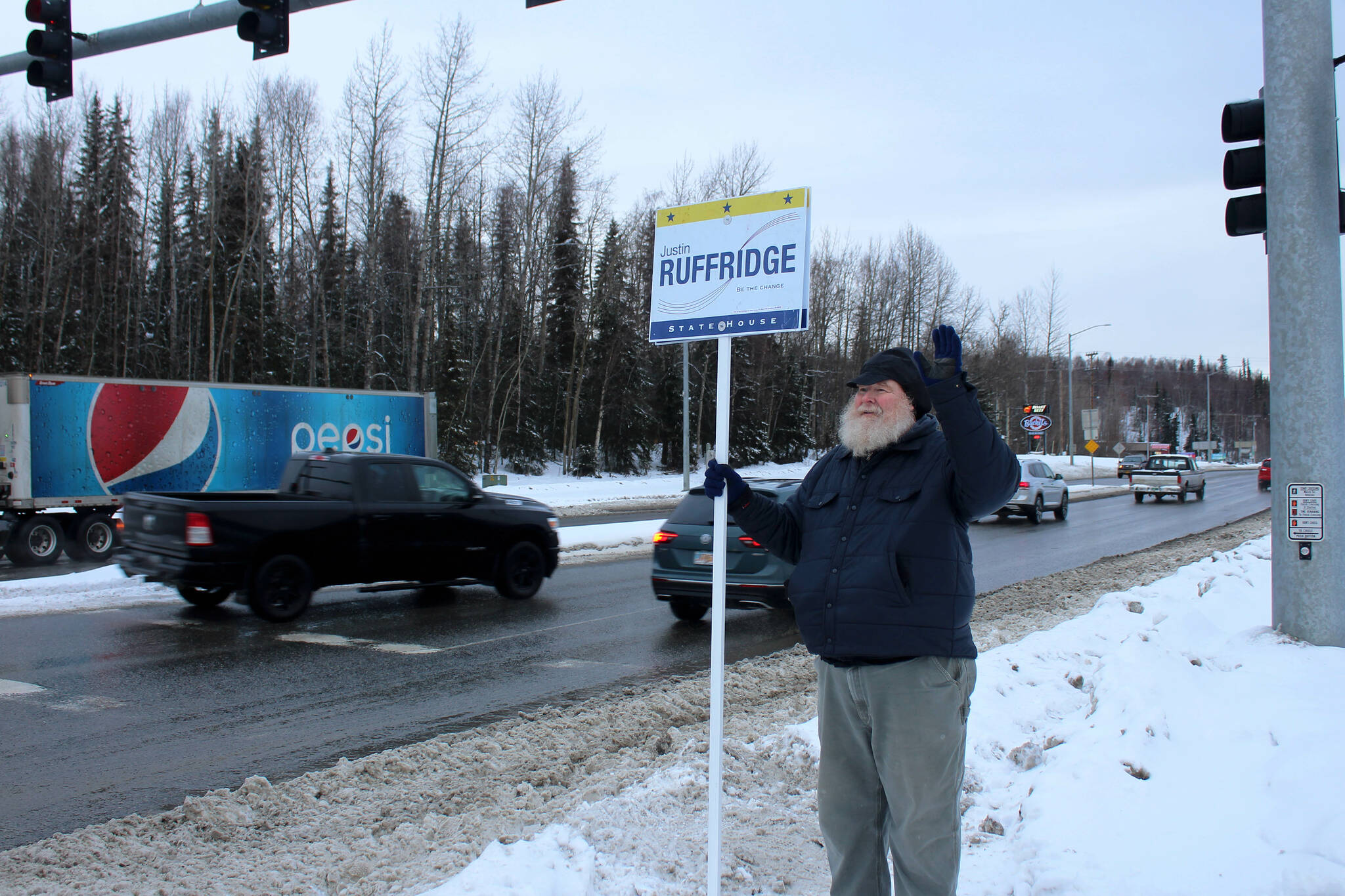Larry Opperman waves a sign in support of Alaska House candidate Justin Ruffridge at the intersection of the Kenai Spur and Sterling highways on Tuesday, Nov. 8, 2022 in Soldotna, Alaska. (Ashlyn O'Hara/Peninsula Clarion)